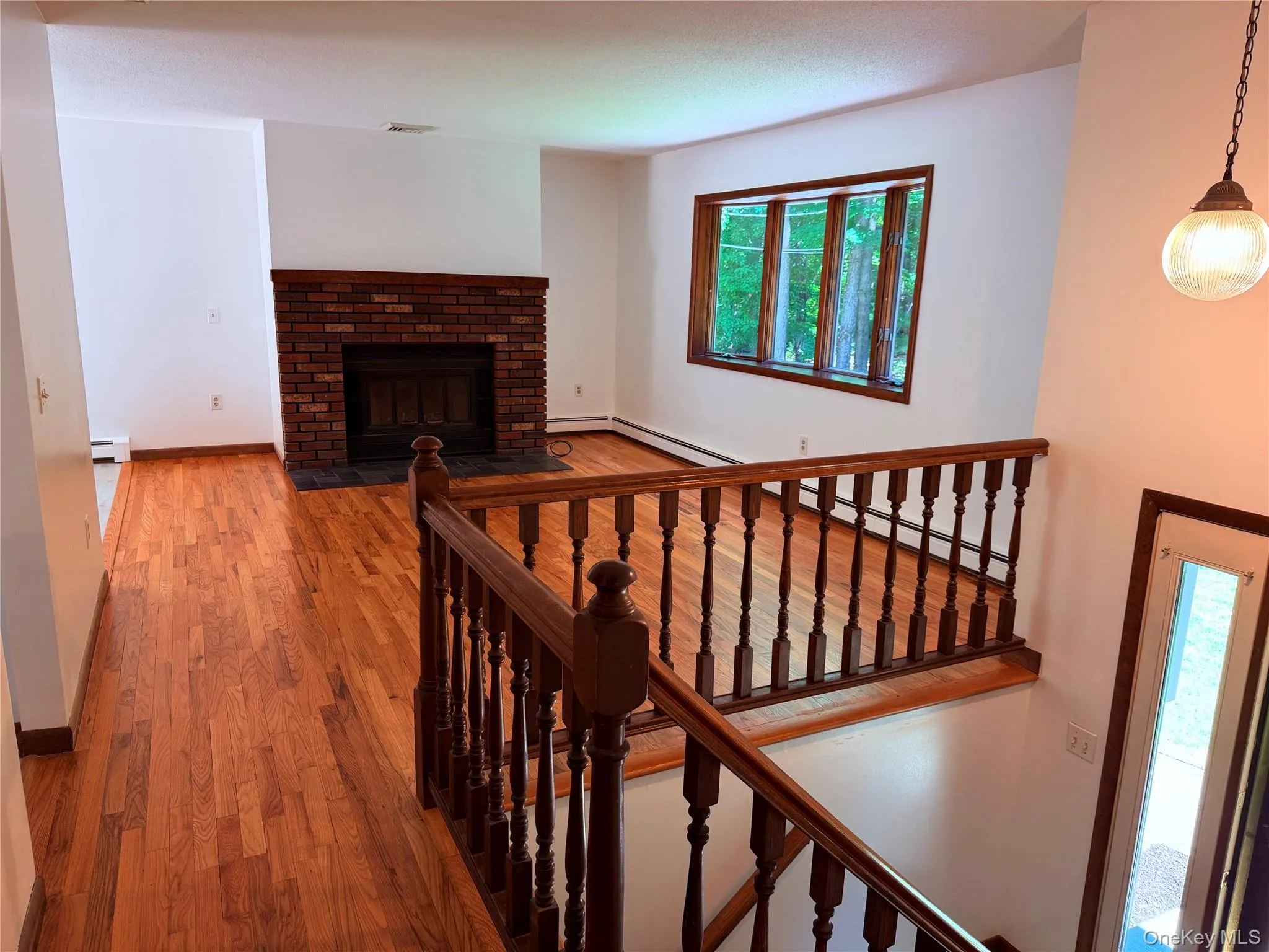 Newly refinished hardwood floors, open to the dining rm and kitchen Newly refinished hardwood floors, open to the dining rm and kitchen