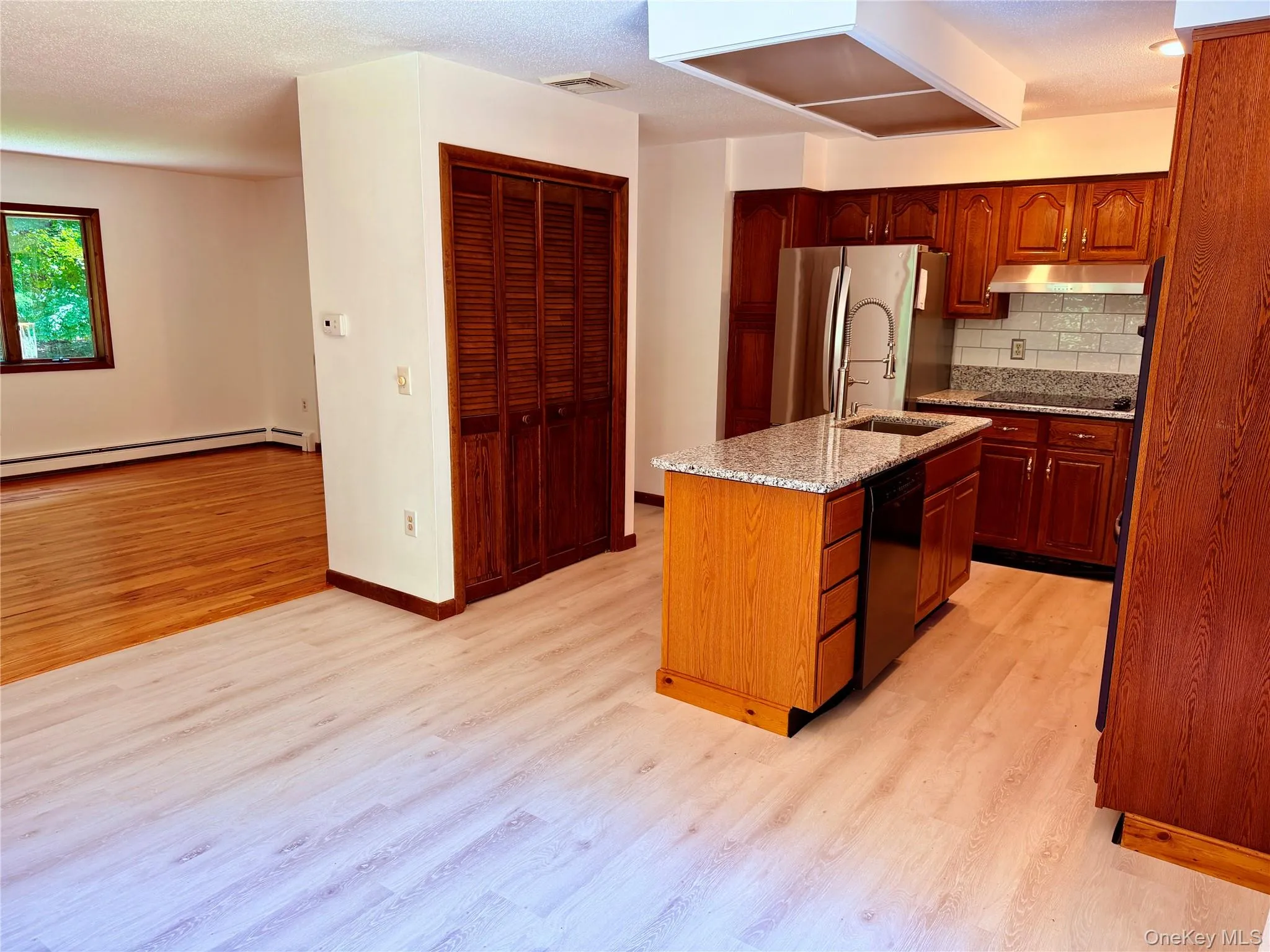 With large pantry, new stone counter tops, newer appliances and beautiful cabinets With large pantry, new stone counter tops, newer appliances and beautiful cabinets