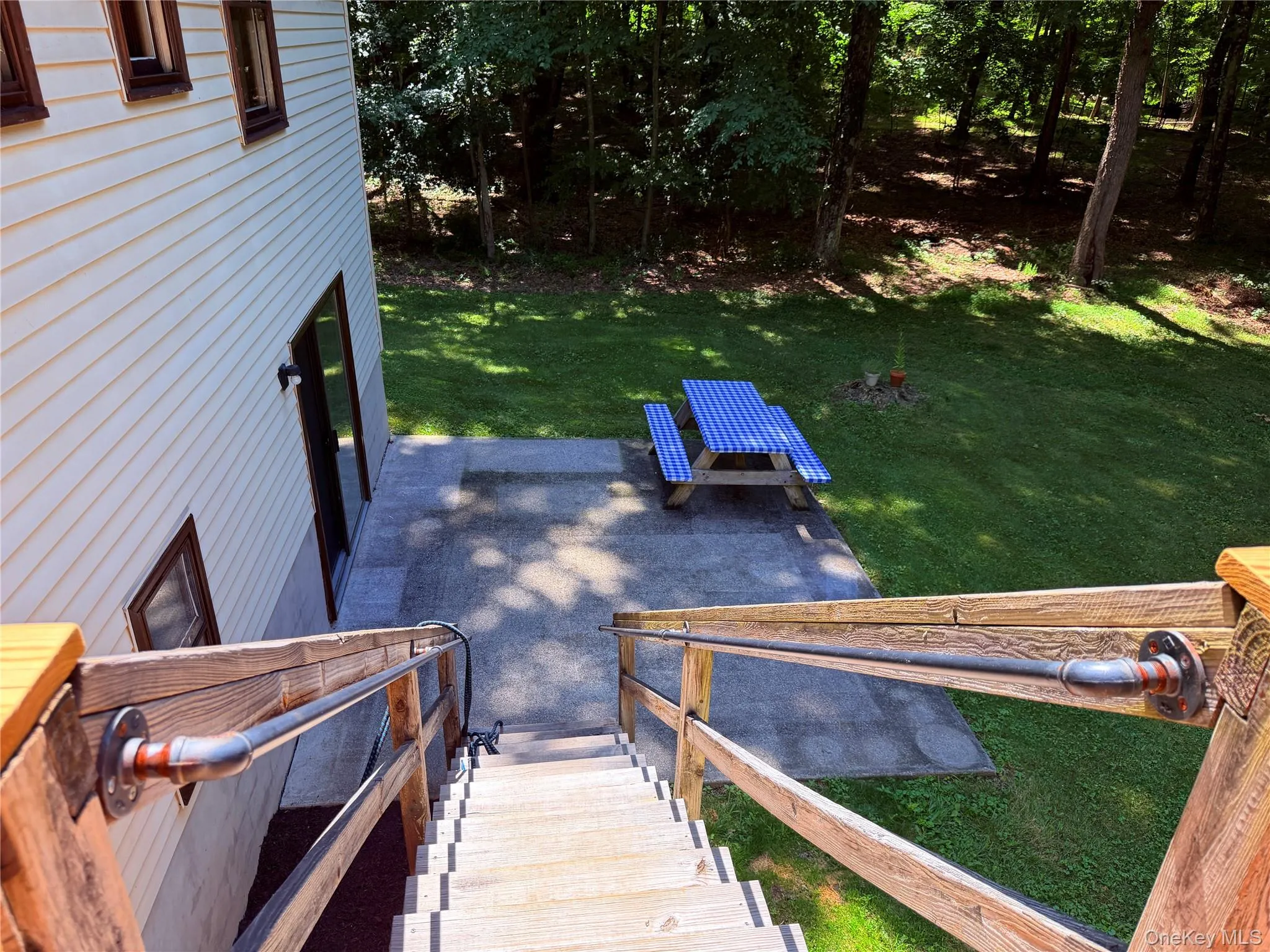 Patio outside of the lower level family room. Patio outside of the lower level family room.