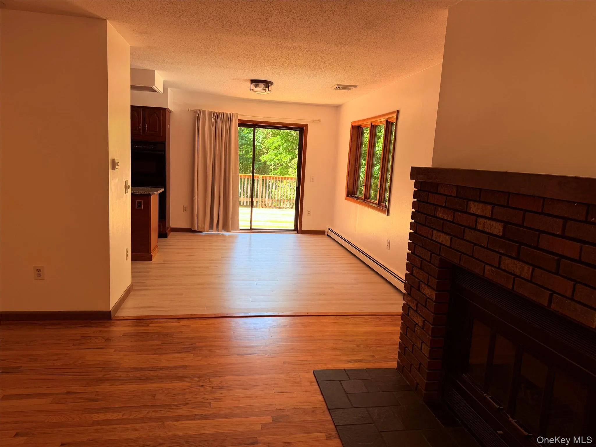 Sliders to the back deck over looking the beautiful backyard and lake. Sliders to the back deck over looking the beautiful backyard and lake.
