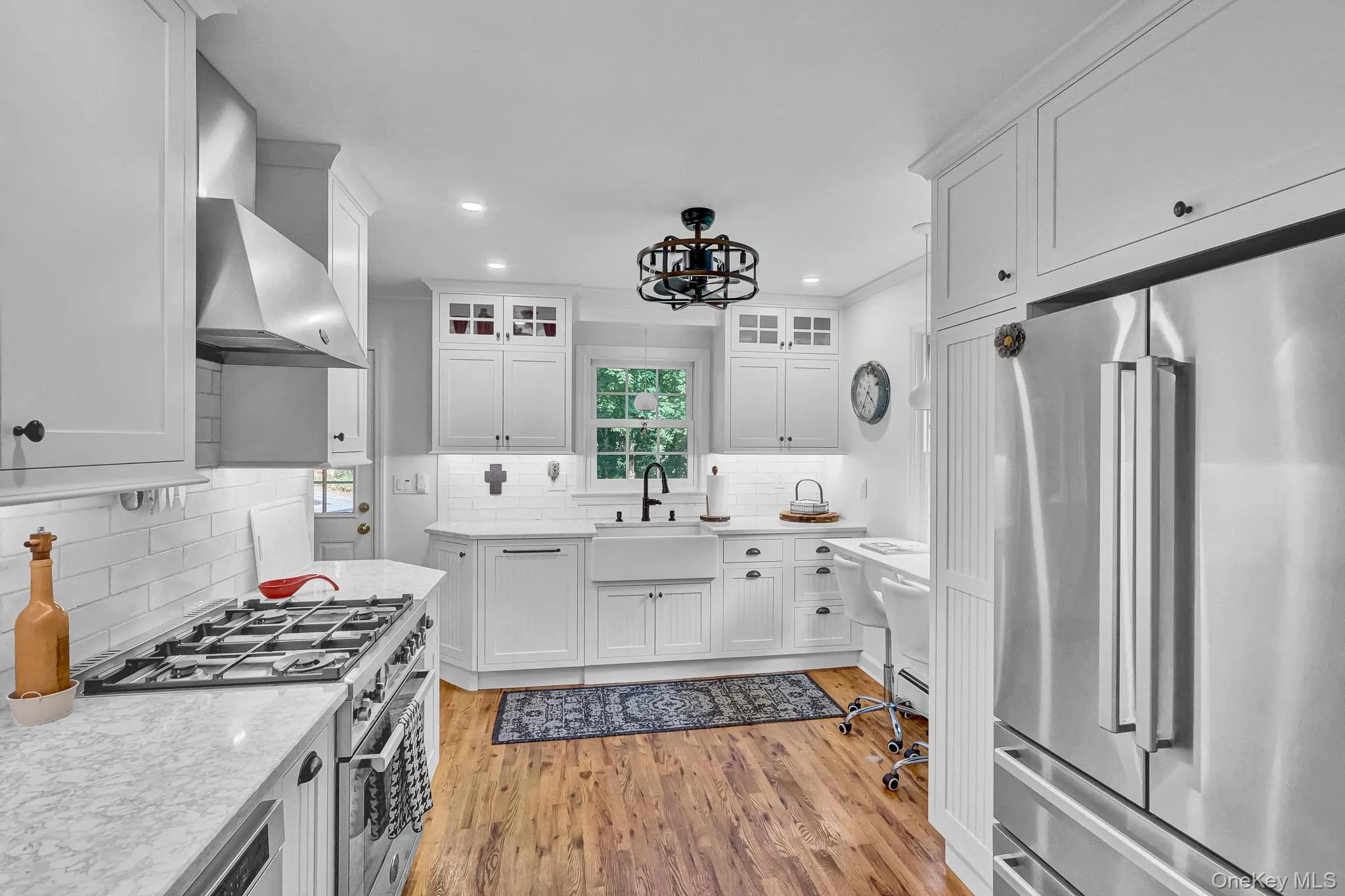 Newly Renovated Kitchen With Custom Cabinetry , New Hardwood Floors, Stainless Appliances, Quartz Counters & Breakfast Bar Open to Large Dining Room! Newly Renovated Kitchen With Custom Cabinetry , New Hardwood Floors, Stainless Appliances, Quartz Counters & Breakfast Bar Open to Large Dining Room!