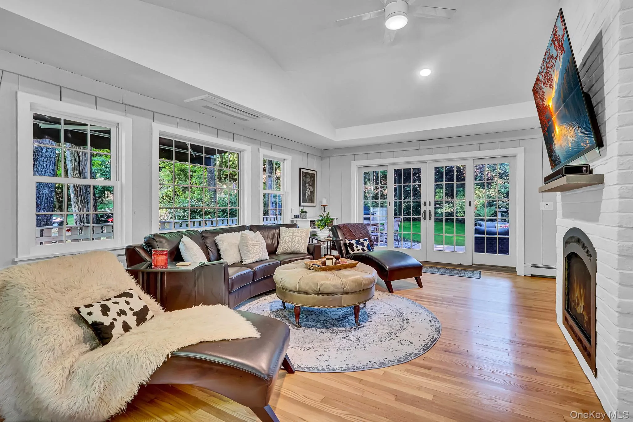 Large Den With Walls Of Windows, Gas Fireplace, Hardwood Floors & Sliders to Deck & Yard Large Den With Walls Of Windows, Gas Fireplace, Hardwood Floors & Sliders to Deck & Yard
