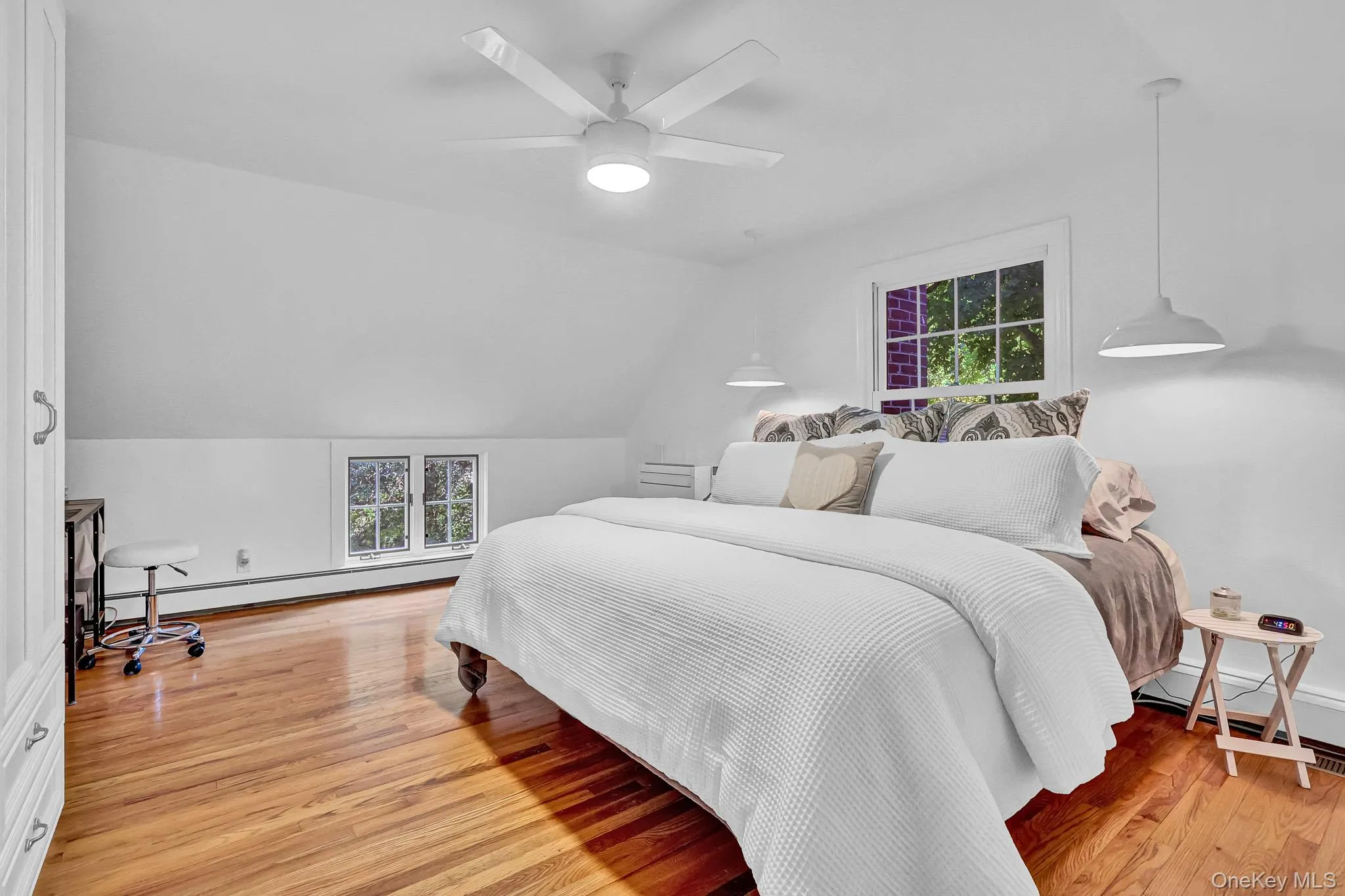 Primary Bedroom With Walls of Built-In Cabinetry & Beautiful Hardwood Floors! Primary Bedroom With Walls of Built-In Cabinetry & Beautiful Hardwood Floors!