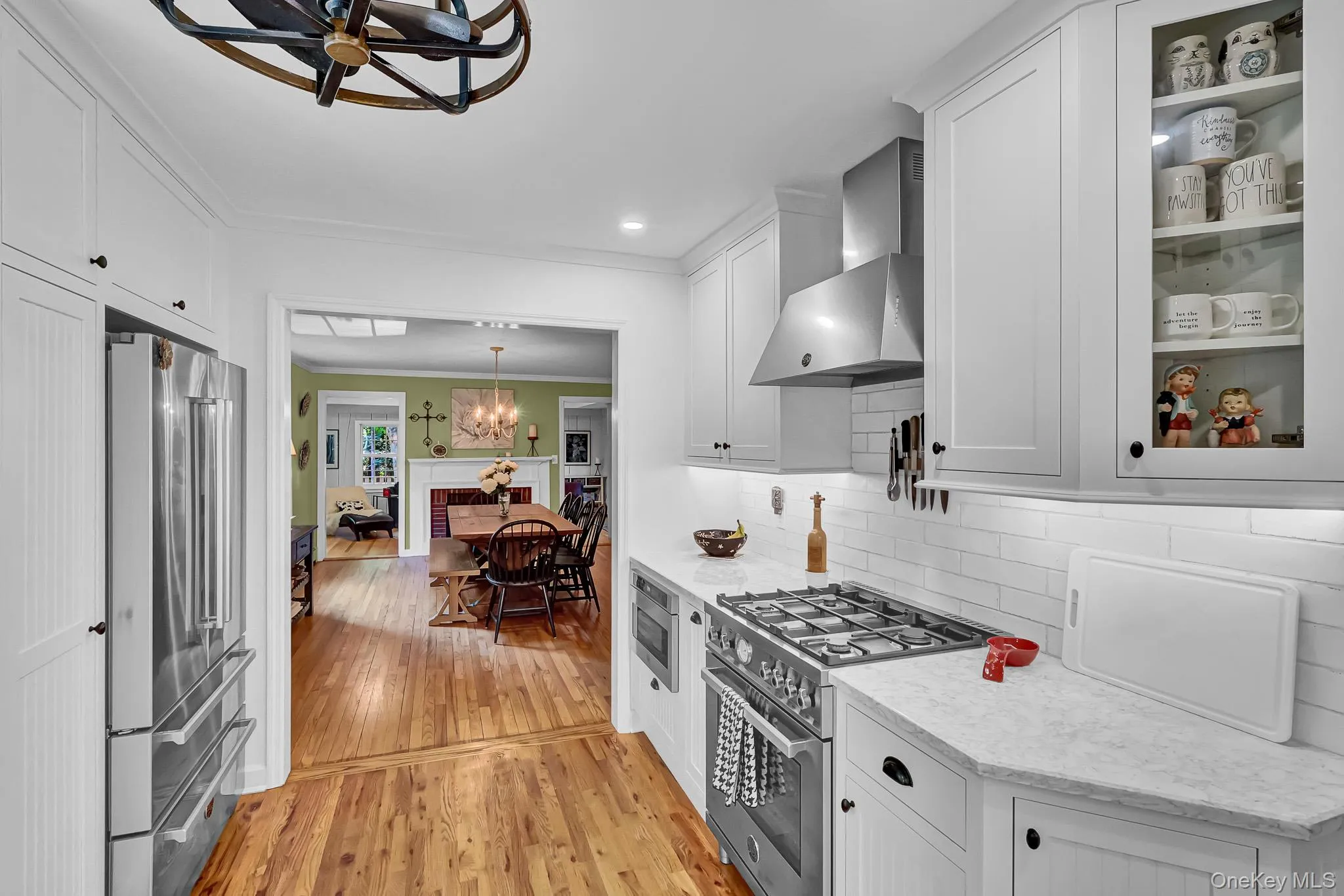 Newly Renovated Kitchen With Custom Cabinetry , New Hardwood Floors, Stainless Appliances, Quartz Counters & Breakfast Bar Open to Large Dining Room! Newly Renovated Kitchen With Custom Cabinetry , New Hardwood Floors, Stainless Appliances, Quartz Counters & Breakfast Bar Open to Large Dining Room!