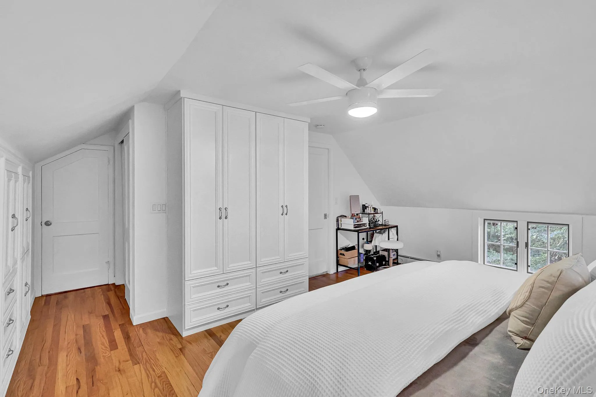 Primary Bedroom With Walls of Built-In Cabinetry & Beautiful Hardwood Floors! Primary Bedroom With Walls of Built-In Cabinetry & Beautiful Hardwood Floors!