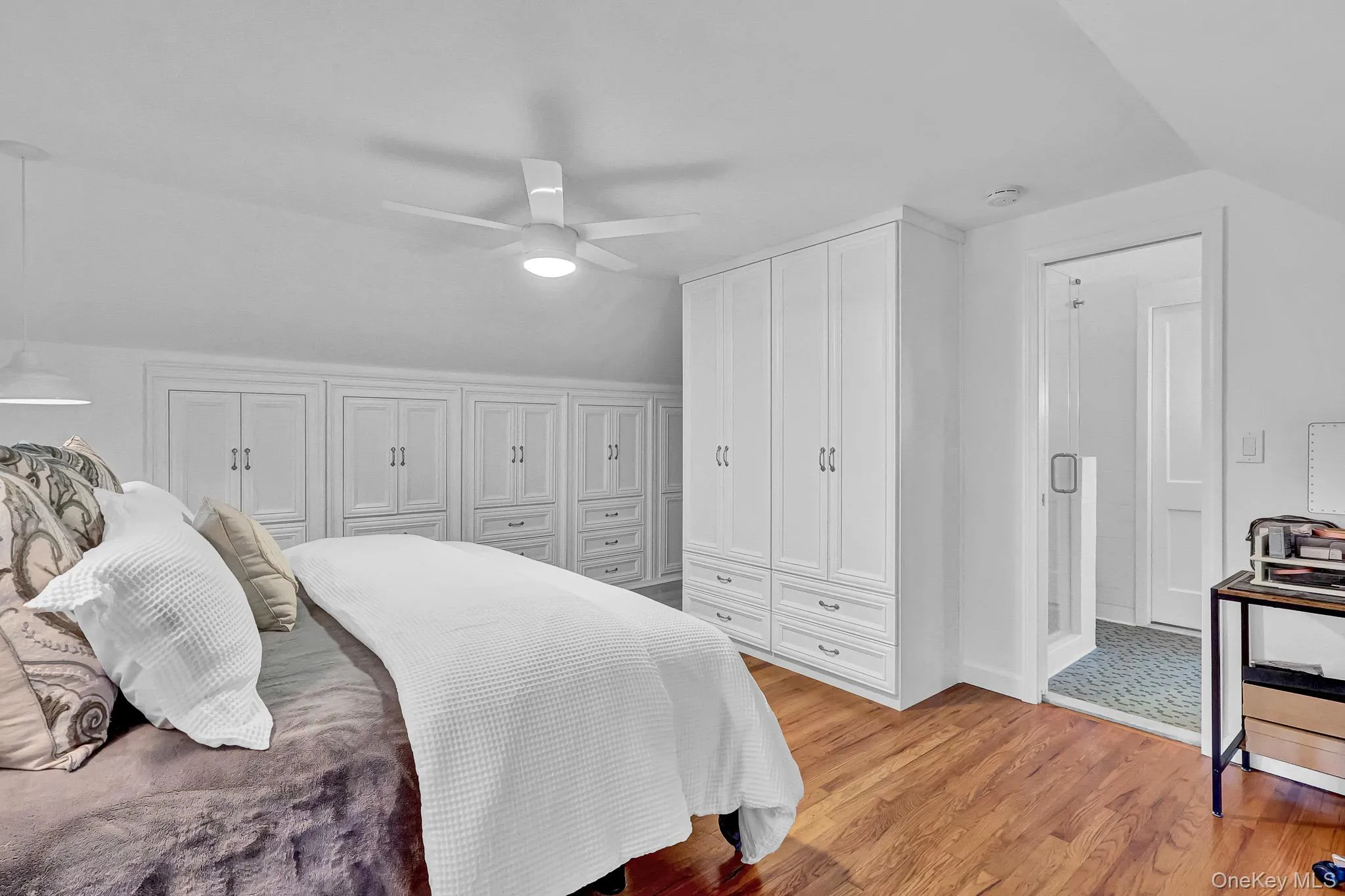 Primary Bedroom With Walls of Built-In Cabinetry & Beautiful Hardwood Floors! Primary Bedroom With Walls of Built-In Cabinetry & Beautiful Hardwood Floors!