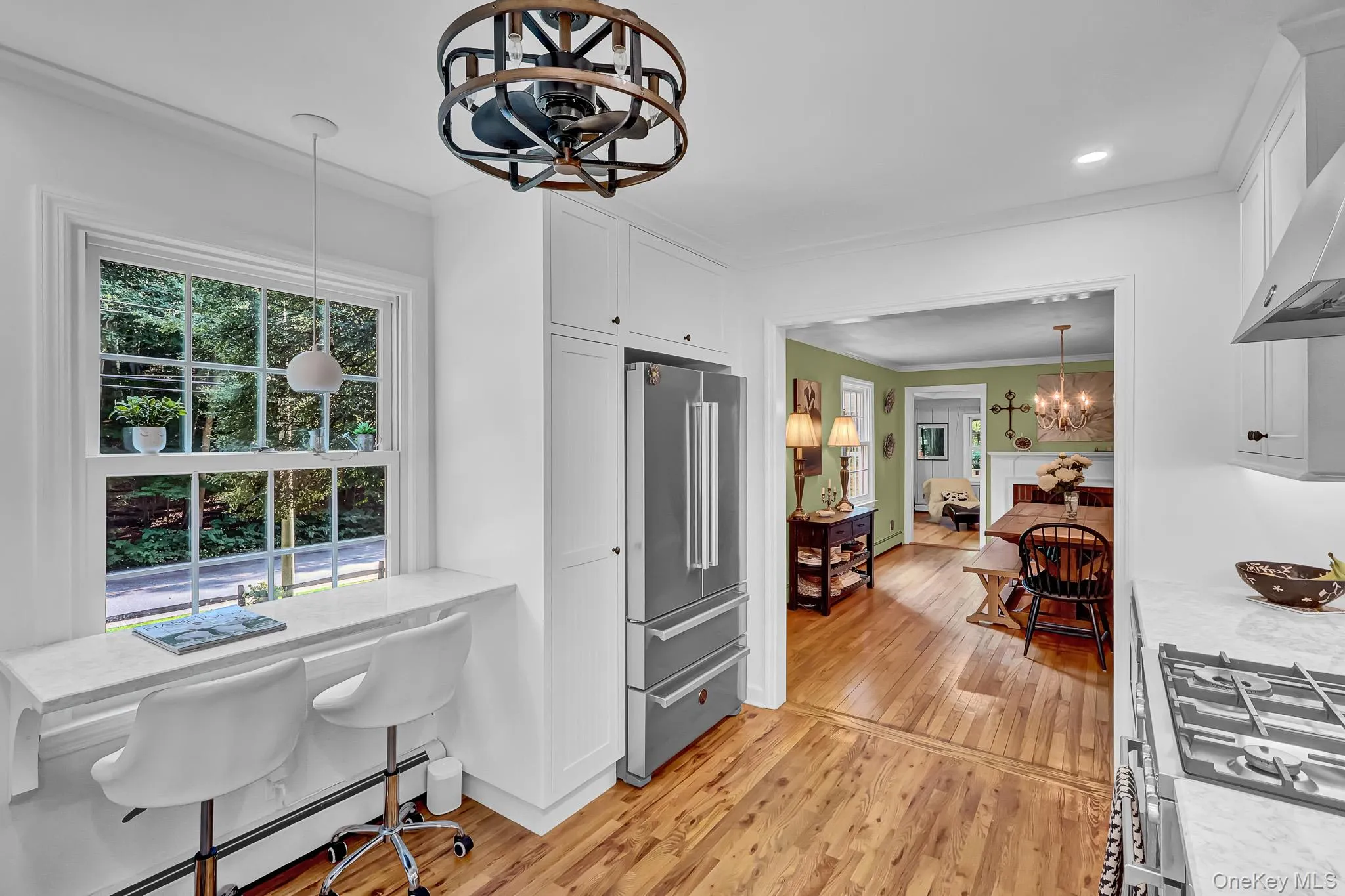 Newly Renovated Kitchen With Custom Cabinetry , New Hardwood Floors, Stainless Appliances, Quartz Counters & Breakfast Bar Open to Large Dining Room! Newly Renovated Kitchen With Custom Cabinetry , New Hardwood Floors, Stainless Appliances, Quartz Counters & Breakfast Bar Open to Large Dining Room!