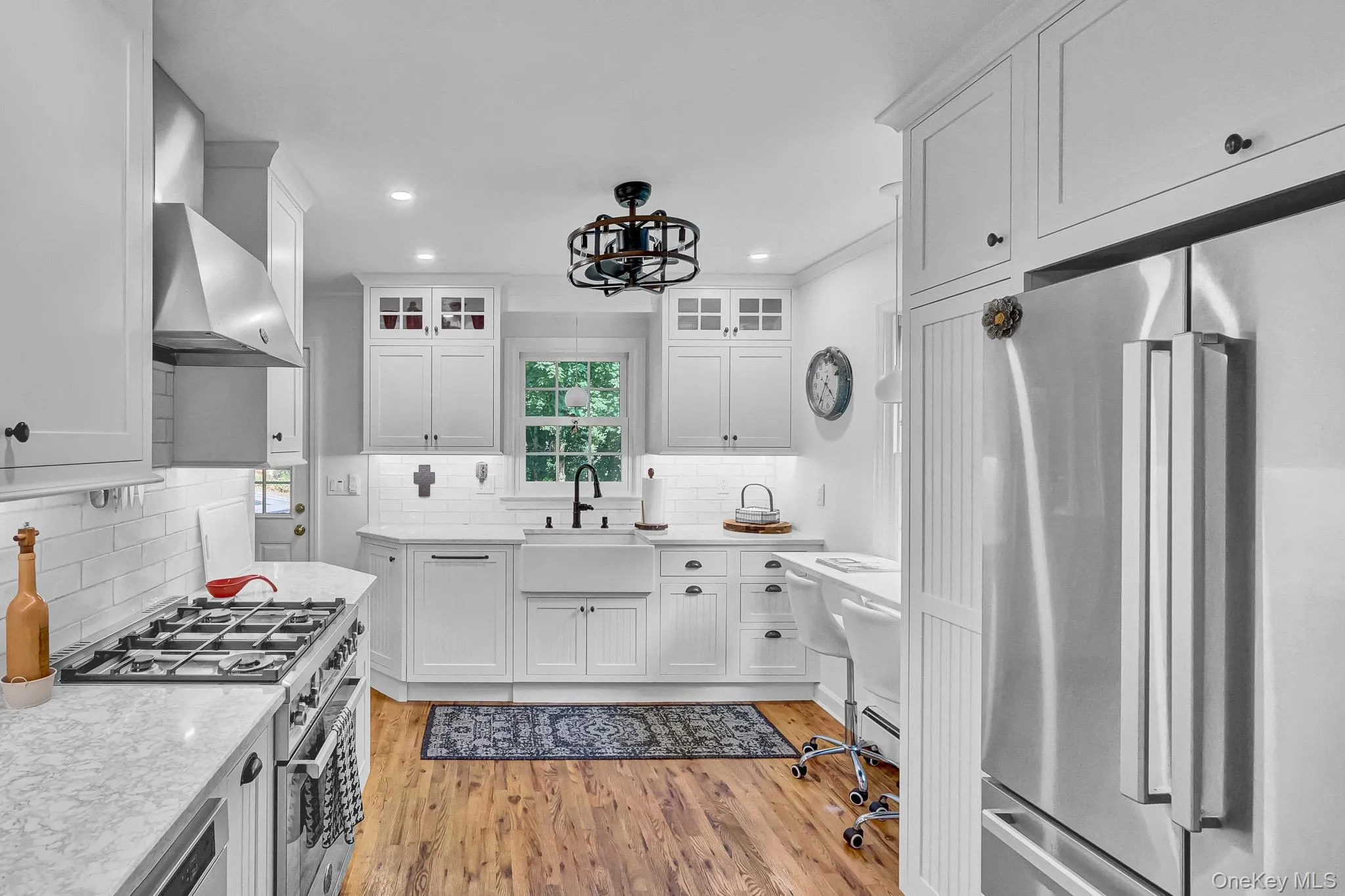 Newly Renovated Kitchen With Custom Cabinetry , New Hardwood Floors, Stainless Appliances, Quartz Counters & Breakfast Bar Open to Large Dining Room! Newly Renovated Kitchen With Custom Cabinetry , New Hardwood Floors, Stainless Appliances, Quartz Counters & Breakfast Bar Open to Large Dining Room!