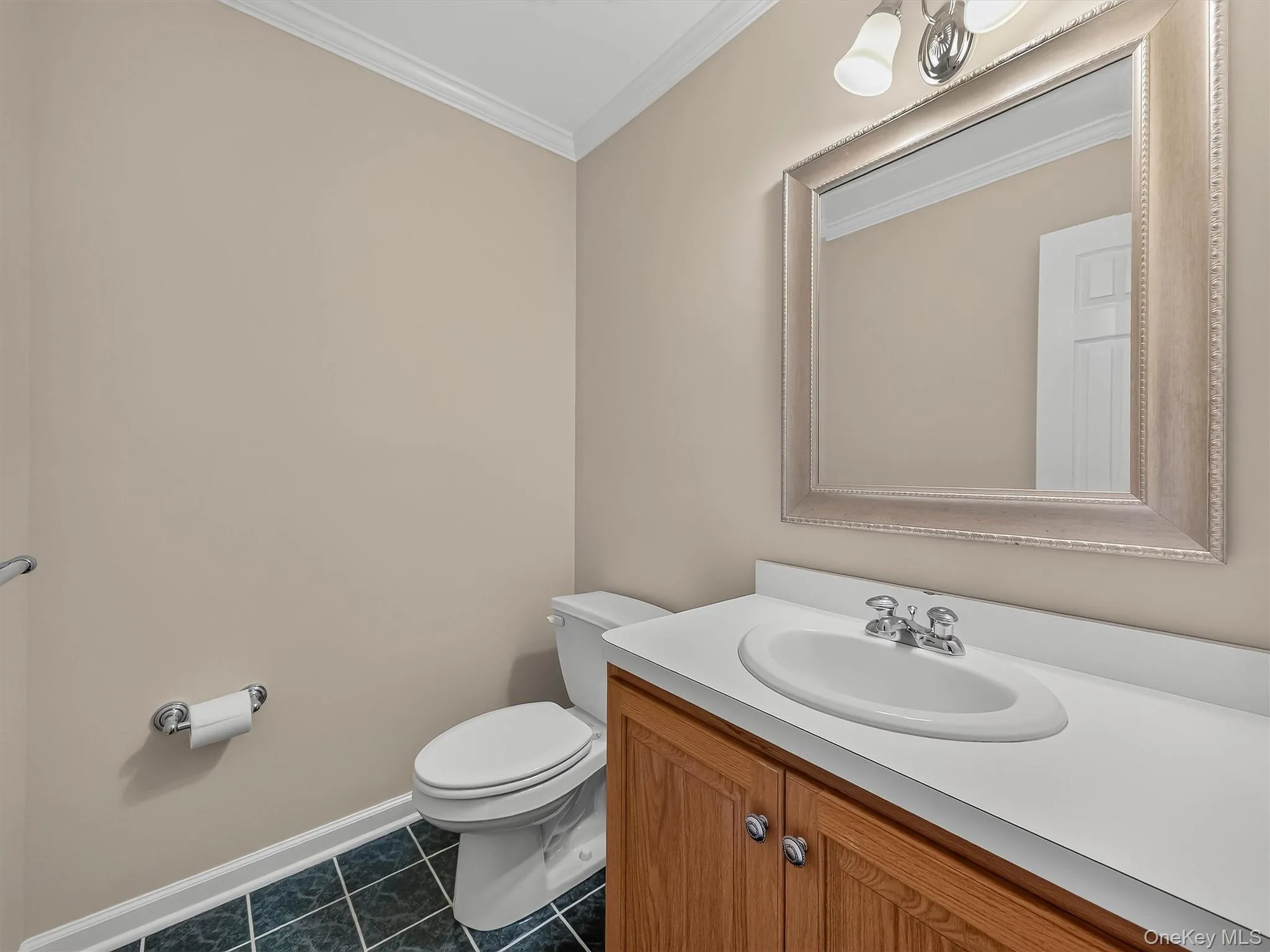 A conveniently located main-level powder room provides added comfort for both everyday living and guests. A conveniently located main-level powder room provides added comfort for both everyday living and guests.