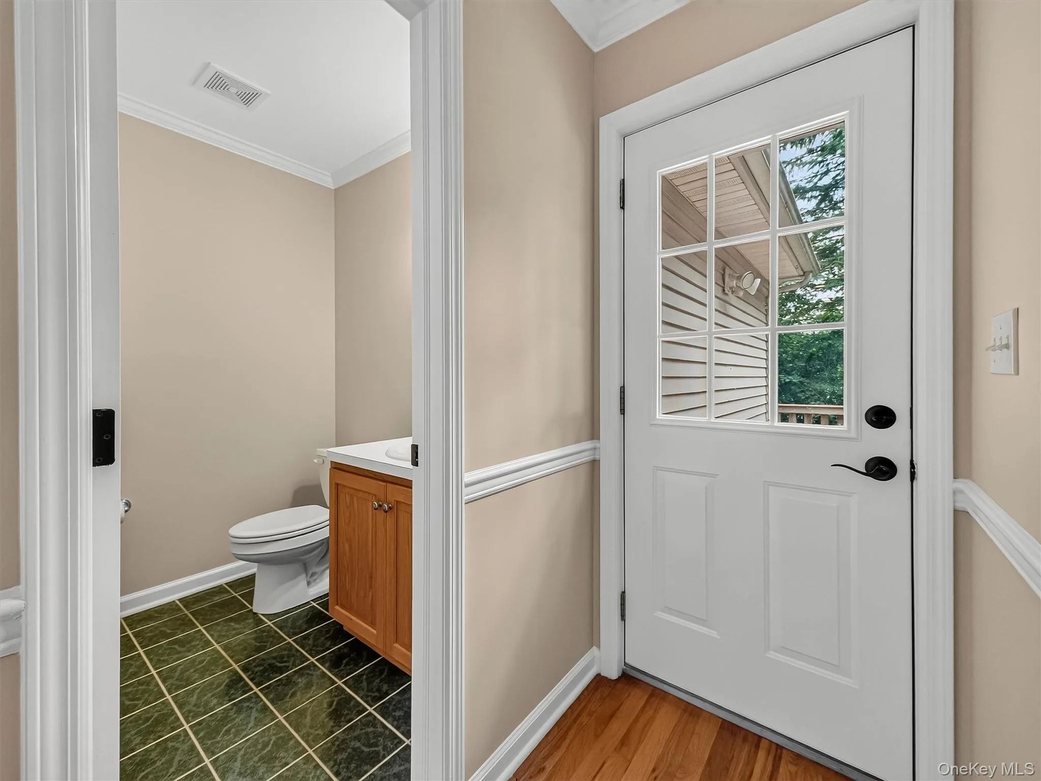 The first-floor powder room and nearby rear entrance add everyday functionality and easy access to the deck. The first-floor powder room and nearby rear entrance add everyday functionality and easy access to the deck.