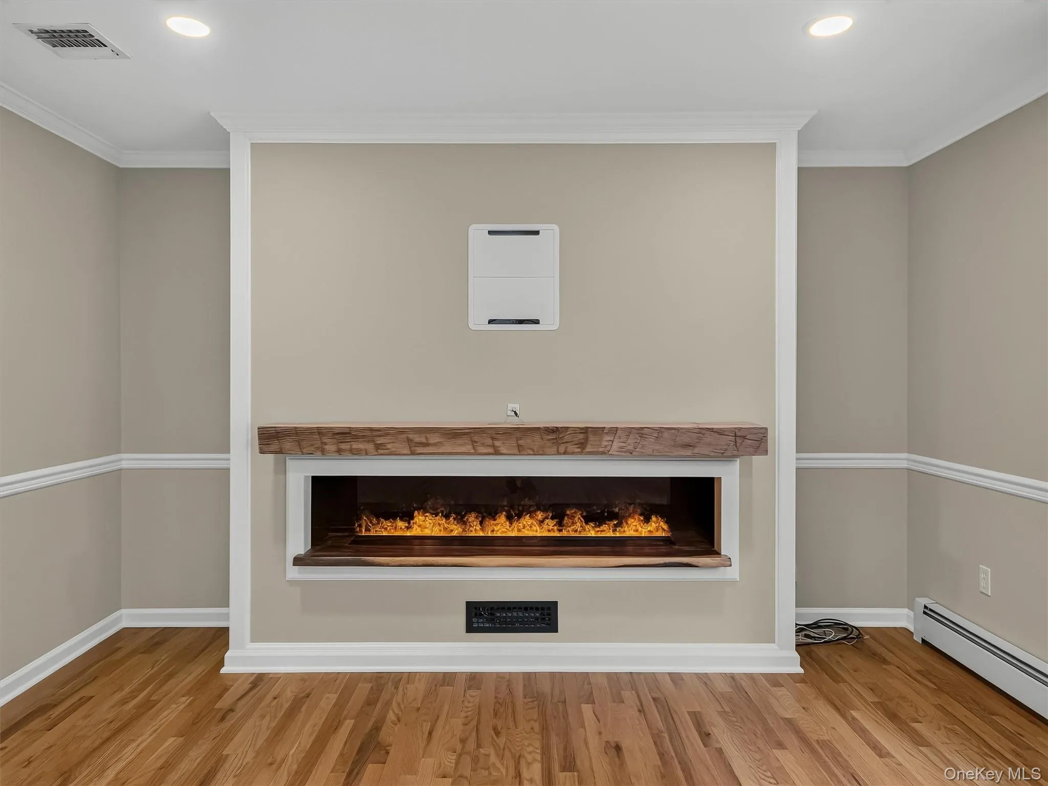 A custom remote-controlled water vapor fireplace creates an incomparable atmosphere with the look of dancing flames in every season. Enjoy year-round ambiance at the touch of a button, with an integrated heater that adds warmth whenever desired—offering the perfect focal point no matter the weather outside. A custom remote-controlled water vapor fireplace creates an incomparable atmosphere with the look of dancing flames in every season. Enjoy year-round ambiance at the touch of a button, with an integrated heater that adds warmth whenever desired—offering the perfect focal point no matter the weather outside.
