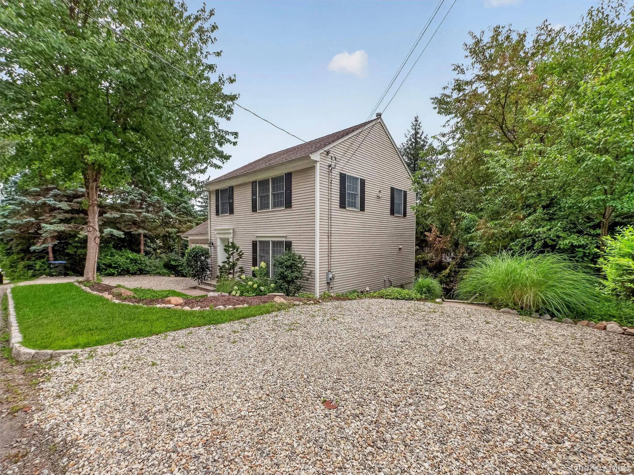 A secondary driveway provides additional parking and convenient private access to the finished lower level, adding flexibility for everyday living. A secondary driveway provides additional parking and convenient private access to the finished lower level, adding flexibility for everyday living.
