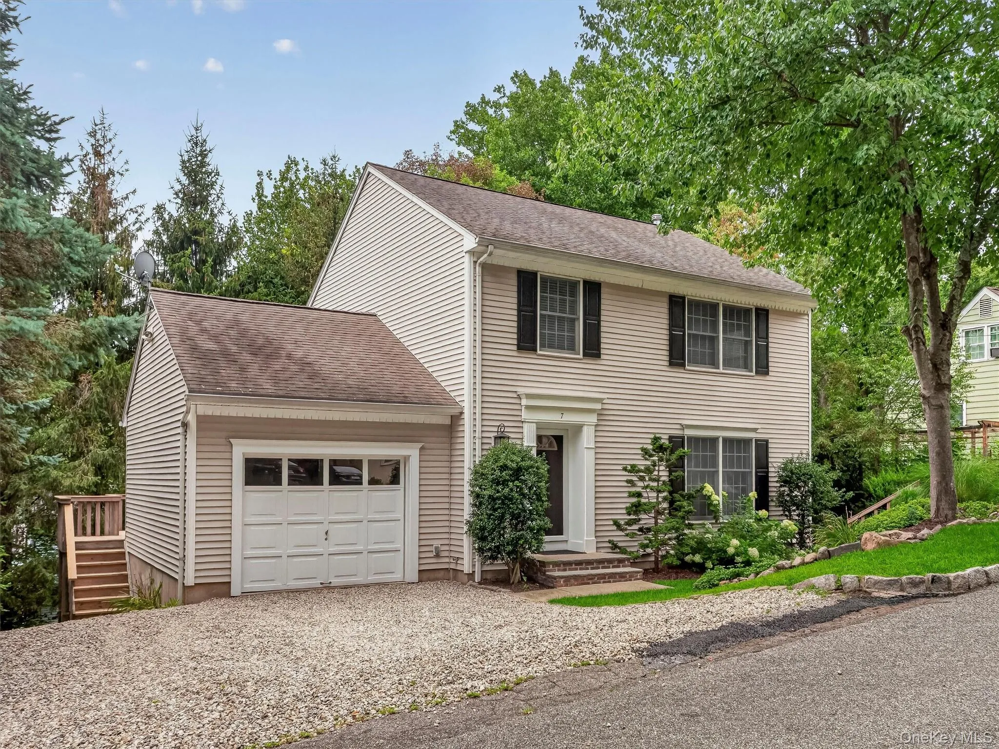 The attached garage, generous parking, and thoughtfully maintained exterior offer everyday convenience with lasting appeal. The attached garage, generous parking, and thoughtfully maintained exterior offer everyday convenience with lasting appeal.