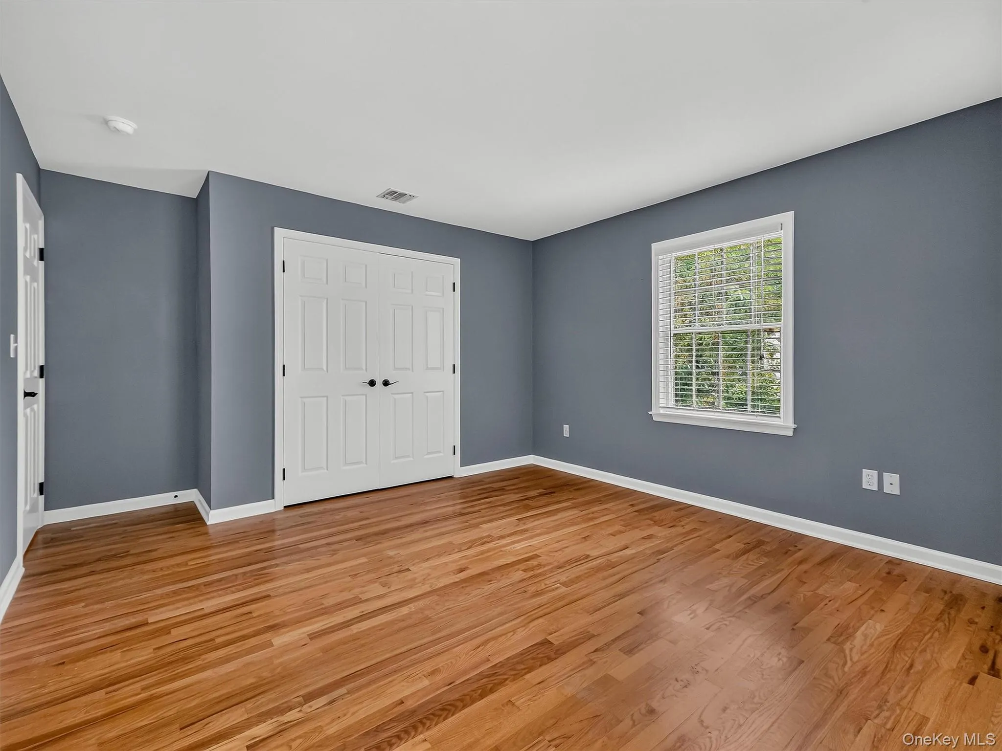 Ample closet provides exceptional storage, adding to the comfort and functionality of this spacious bedroom. Ample closet provides exceptional storage, adding to the comfort and functionality of this spacious bedroom.