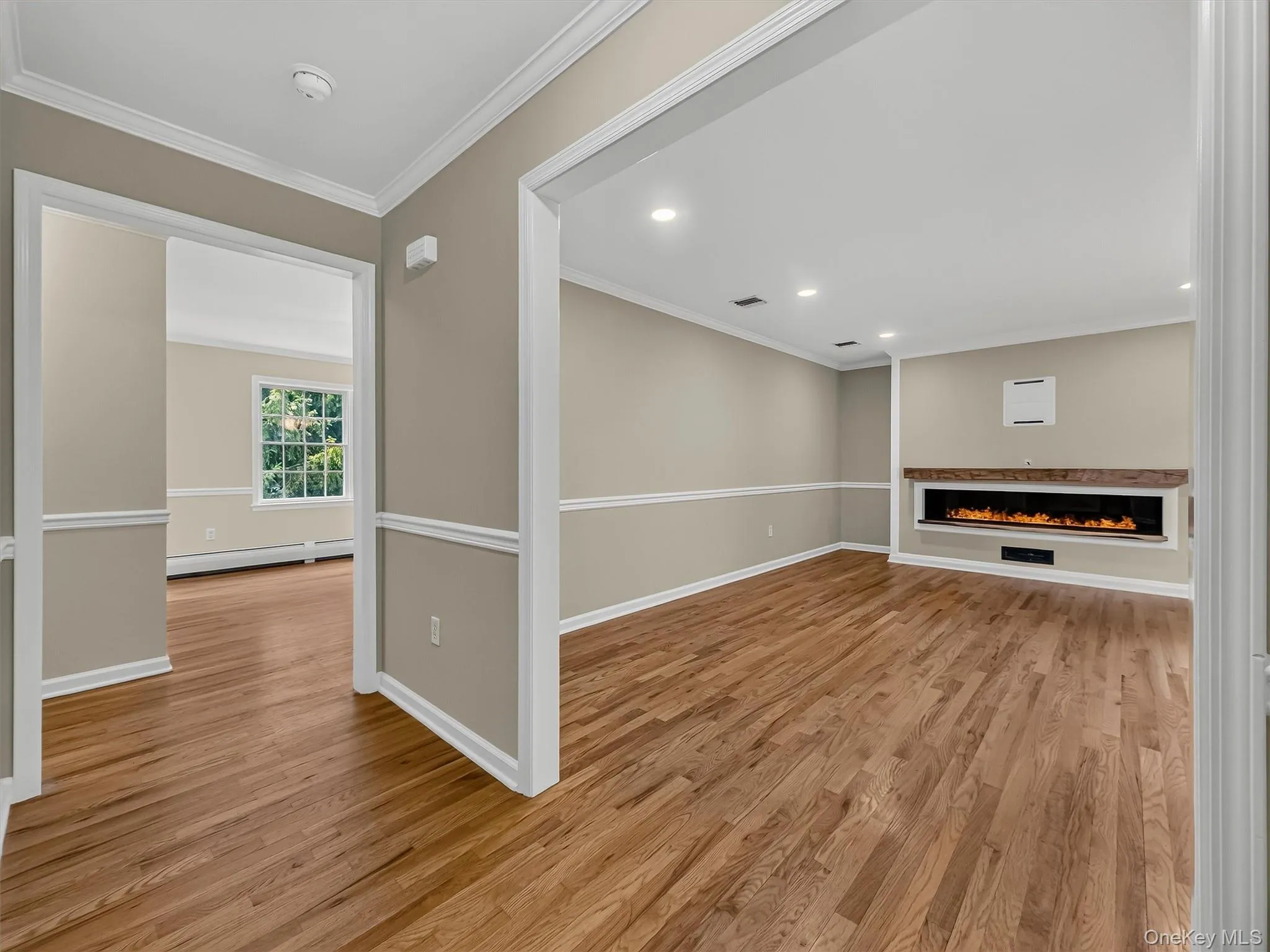 Custom trim work, and wide cased openings create an elegant flow while showcasing the exceptional craftsmanship found throughout the home. Custom trim work, and wide cased openings create an elegant flow while showcasing the exceptional craftsmanship found throughout the home.