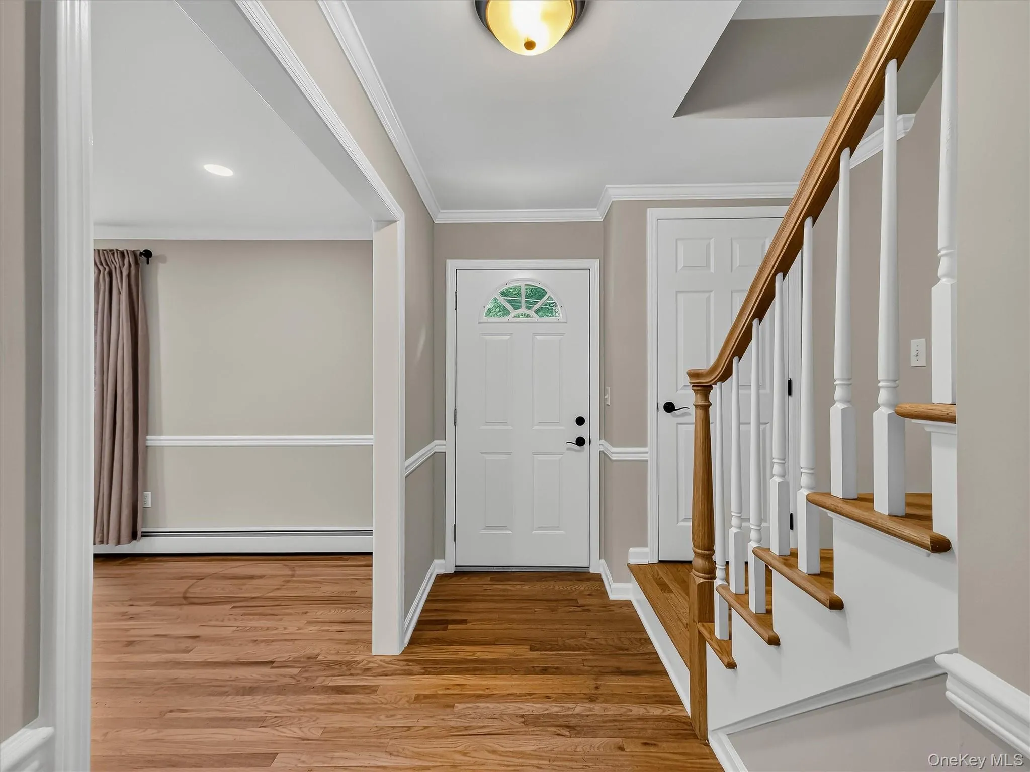 A functional entry with a convenient coat closet is complemented by hardwood floors and custom trim work, setting the tone for the quality found throughout the home. A functional entry with a convenient coat closet is complemented by hardwood floors and custom trim work, setting the tone for the quality found throughout the home.