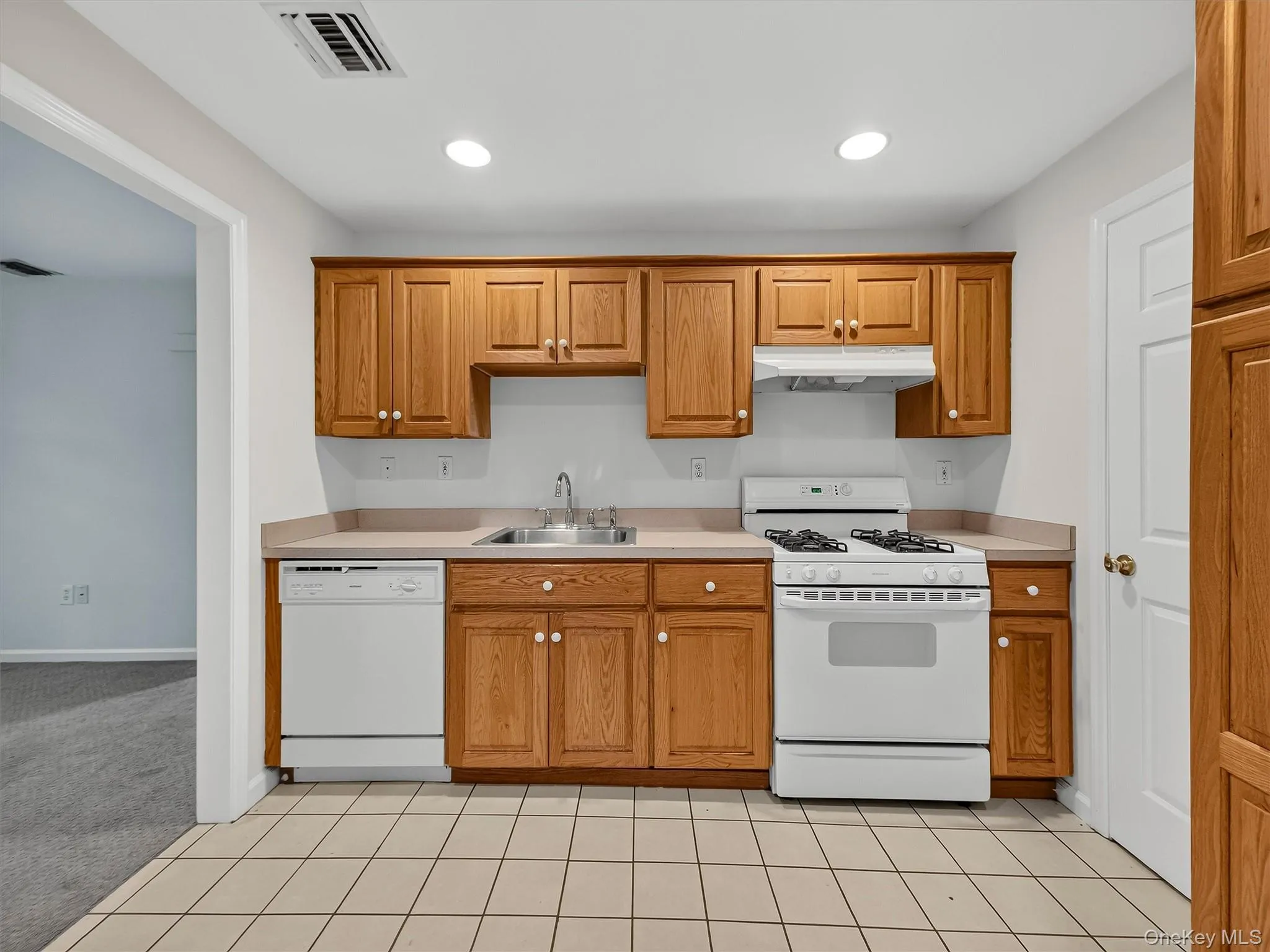 The finished lower level features a fully equipped summer kitchen with abundant cabinetry and workspace, adding exceptional flexibility for entertaining and everyday living. The finished lower level features a fully equipped summer kitchen with abundant cabinetry and workspace, adding exceptional flexibility for entertaining and everyday living.
