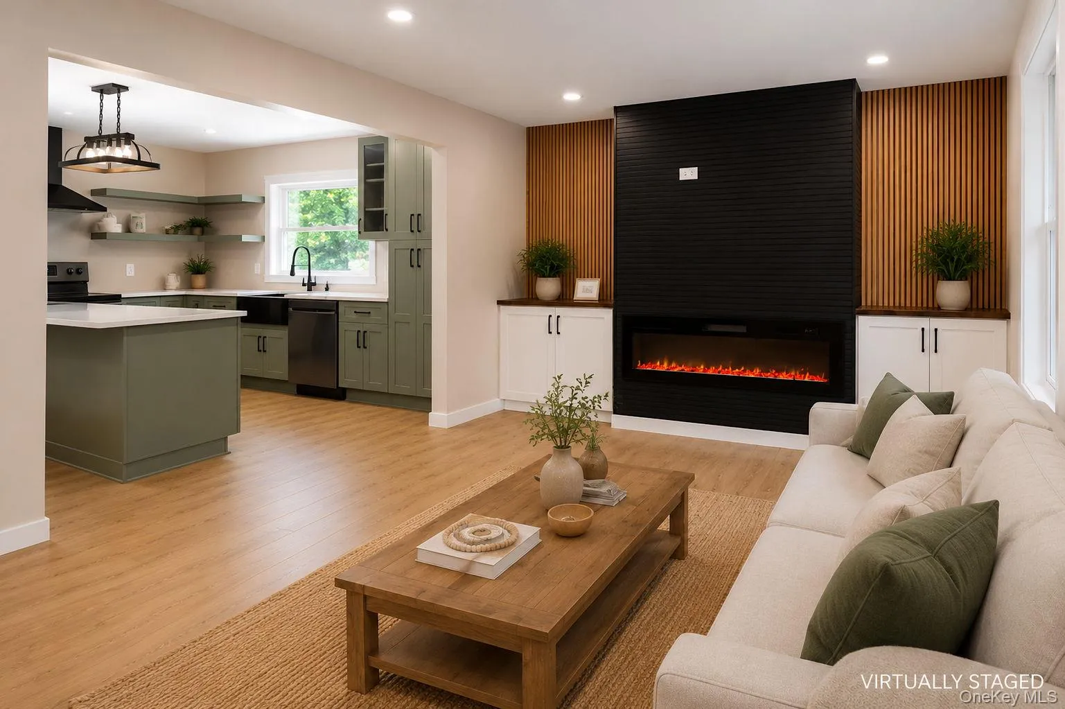 Open-concept living space featuring wood-finish flooring Open-concept living space featuring wood-finish flooring