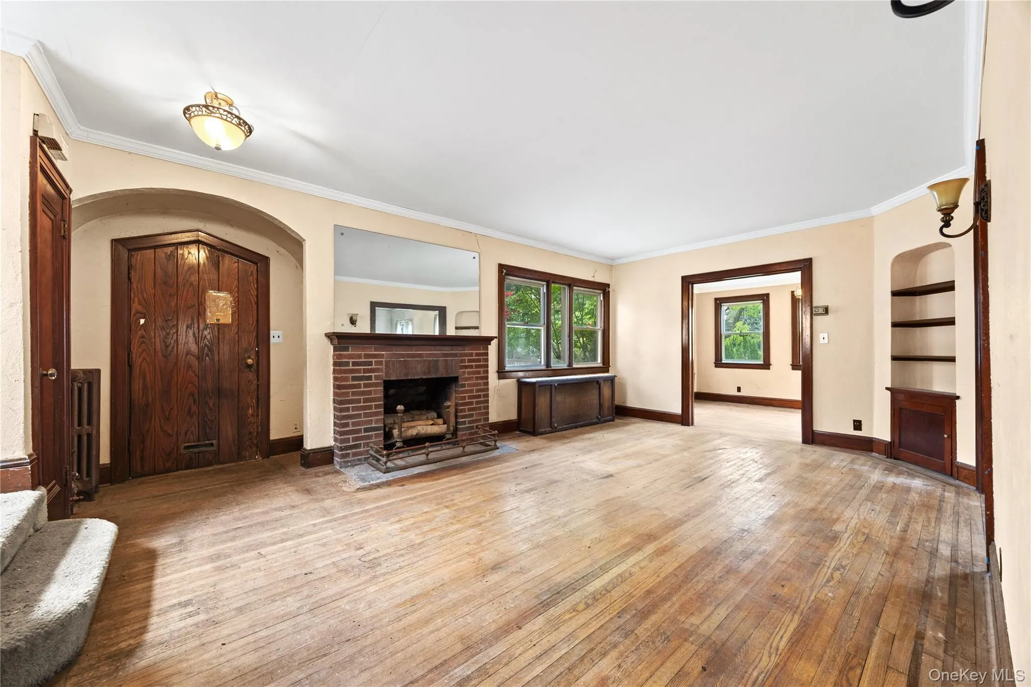 Living room featuring a brick fireplace. Living room featuring a brick fireplace.