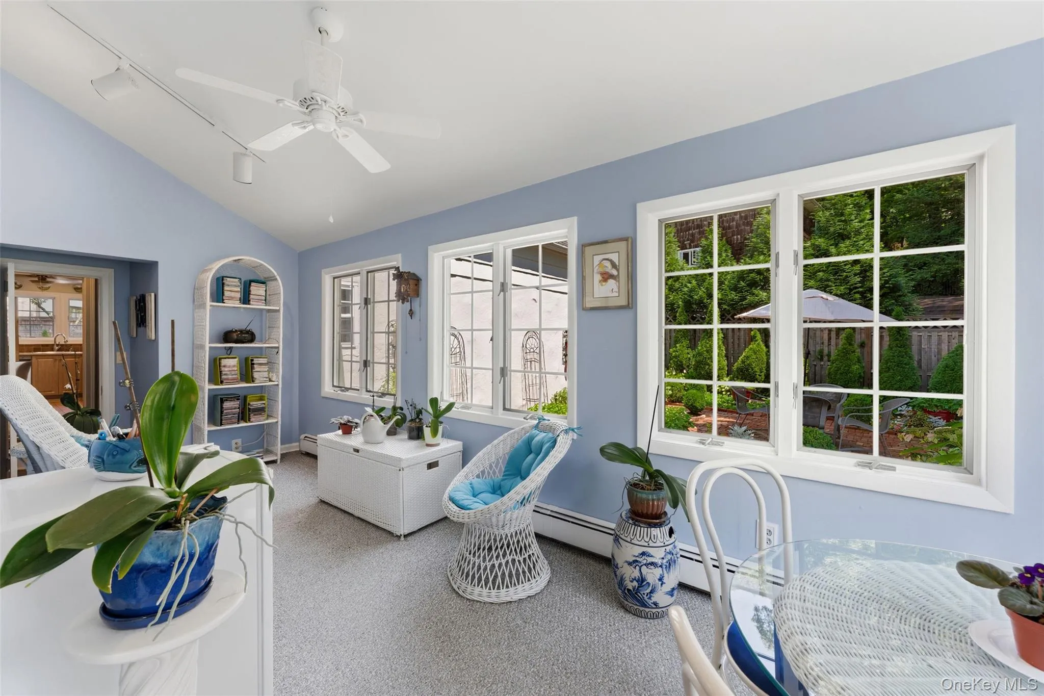 Sunroom with gorgeous garden views and high ceilings. Sunroom with gorgeous garden views and high ceilings.