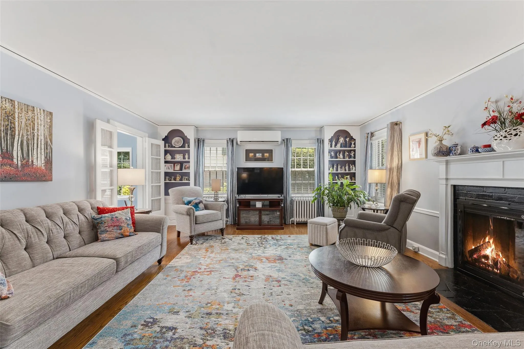 Spacious Living Room with wood-burning fireplace and built-in shelves and cabinetry. Spacious Living Room with wood-burning fireplace and built-in shelves and cabinetry.