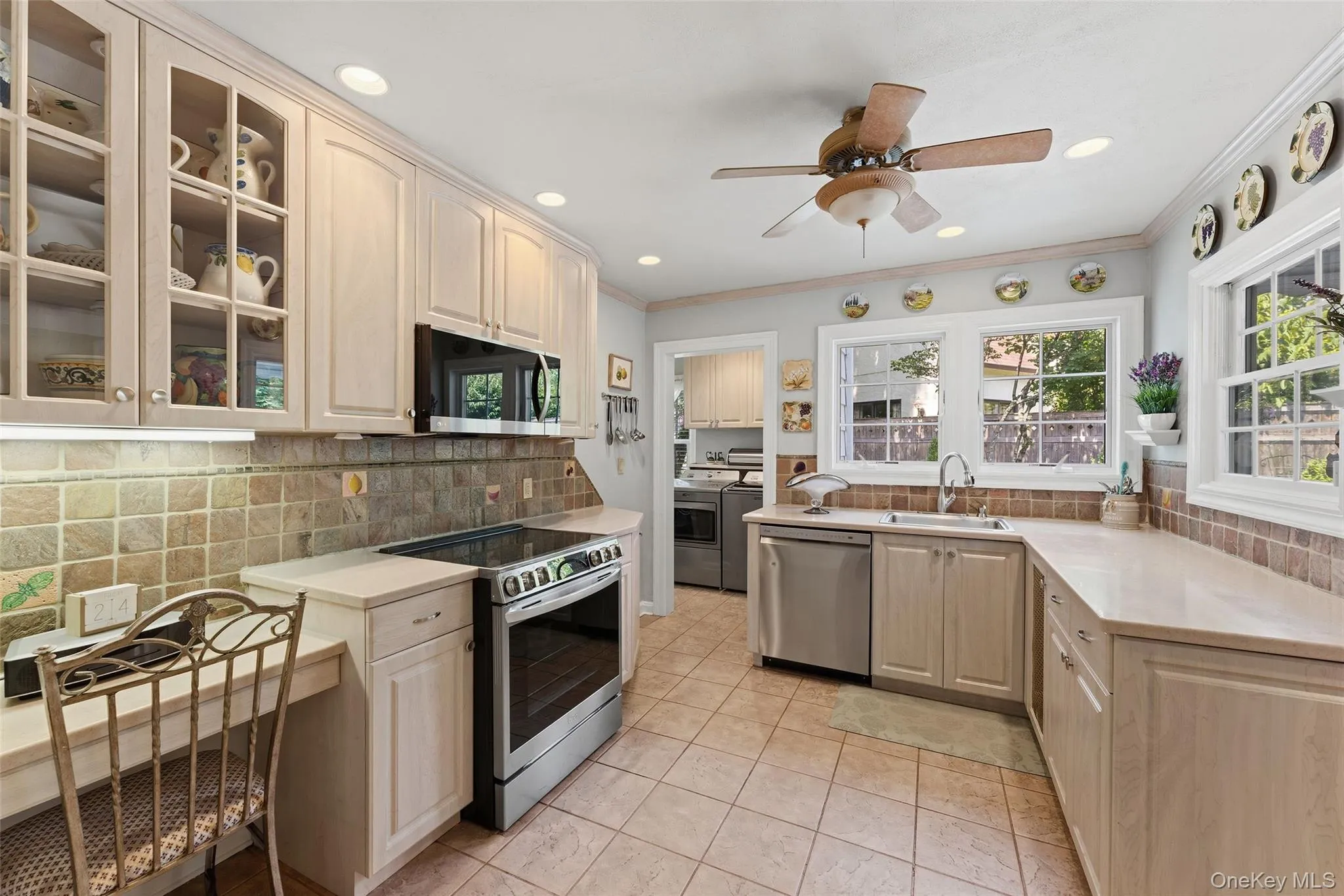 View of the Kitchen featuring 3 windows and recessed lighting. View of the Kitchen featuring 3 windows and recessed lighting.