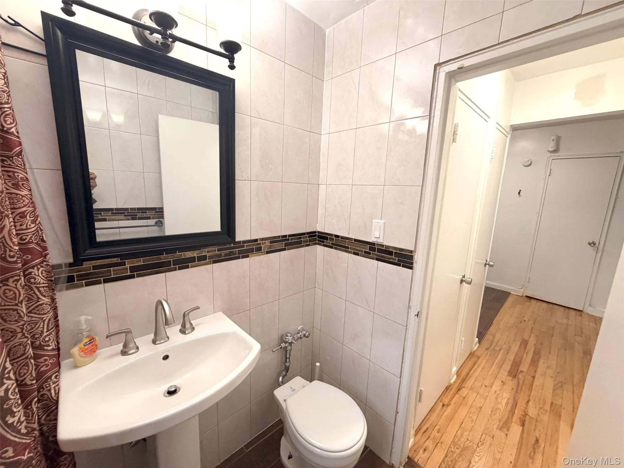 Pedestal sink with a polished chrome faucet set Pedestal sink with a polished chrome faucet set