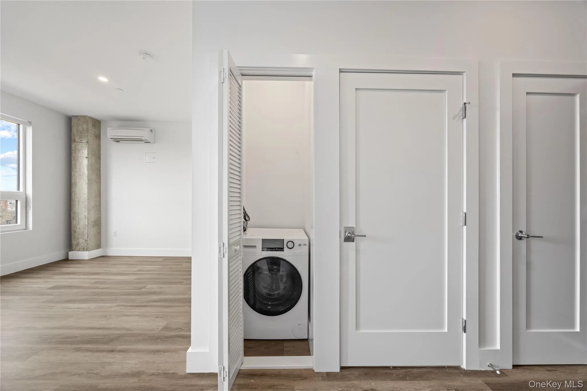 In-unit laundry closet with a front-loading washer In-unit laundry closet with a front-loading washer