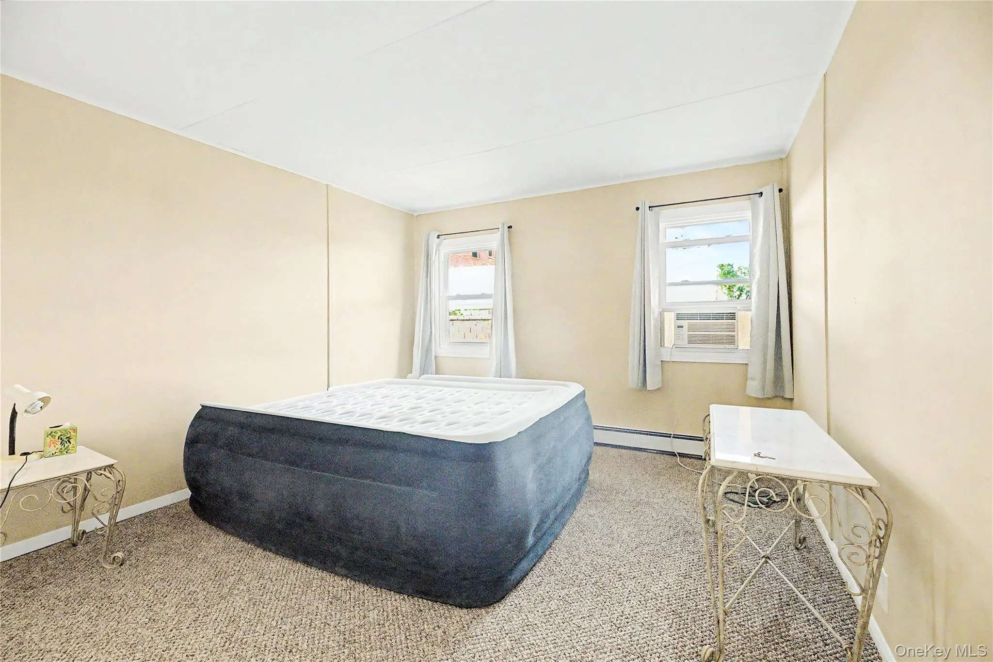 Neutral-toned walls complement the textured carpeting Neutral-toned walls complement the textured carpeting