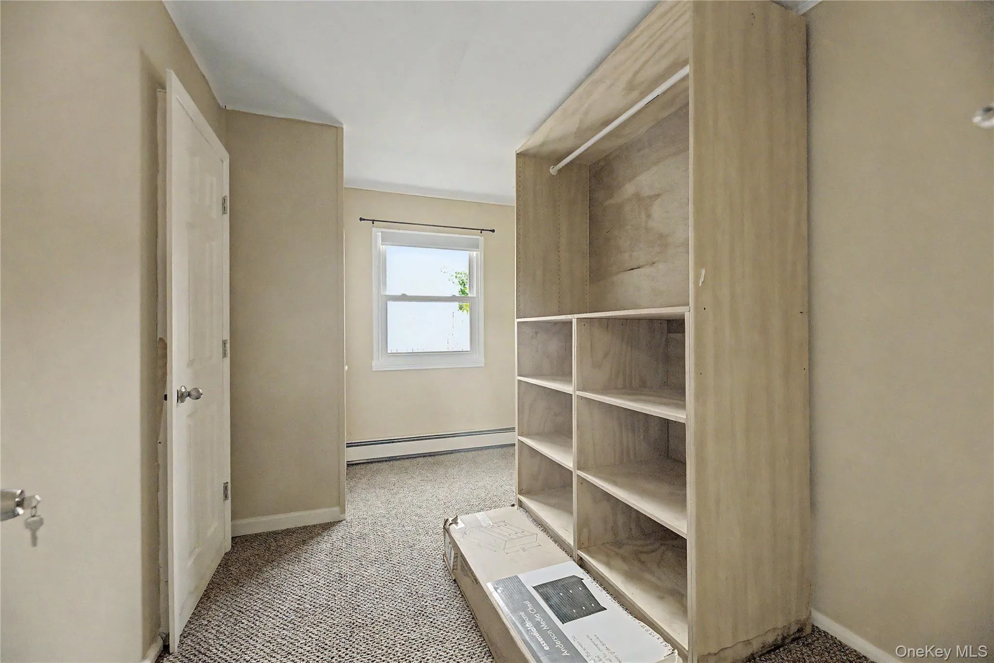 Bright and spacious bedroom featuring neutral décor, carpeted flooring, and abundant natural light from a multi-pane window Bright and spacious bedroom featuring neutral décor, carpeted flooring, and abundant natural light from a multi-pane window