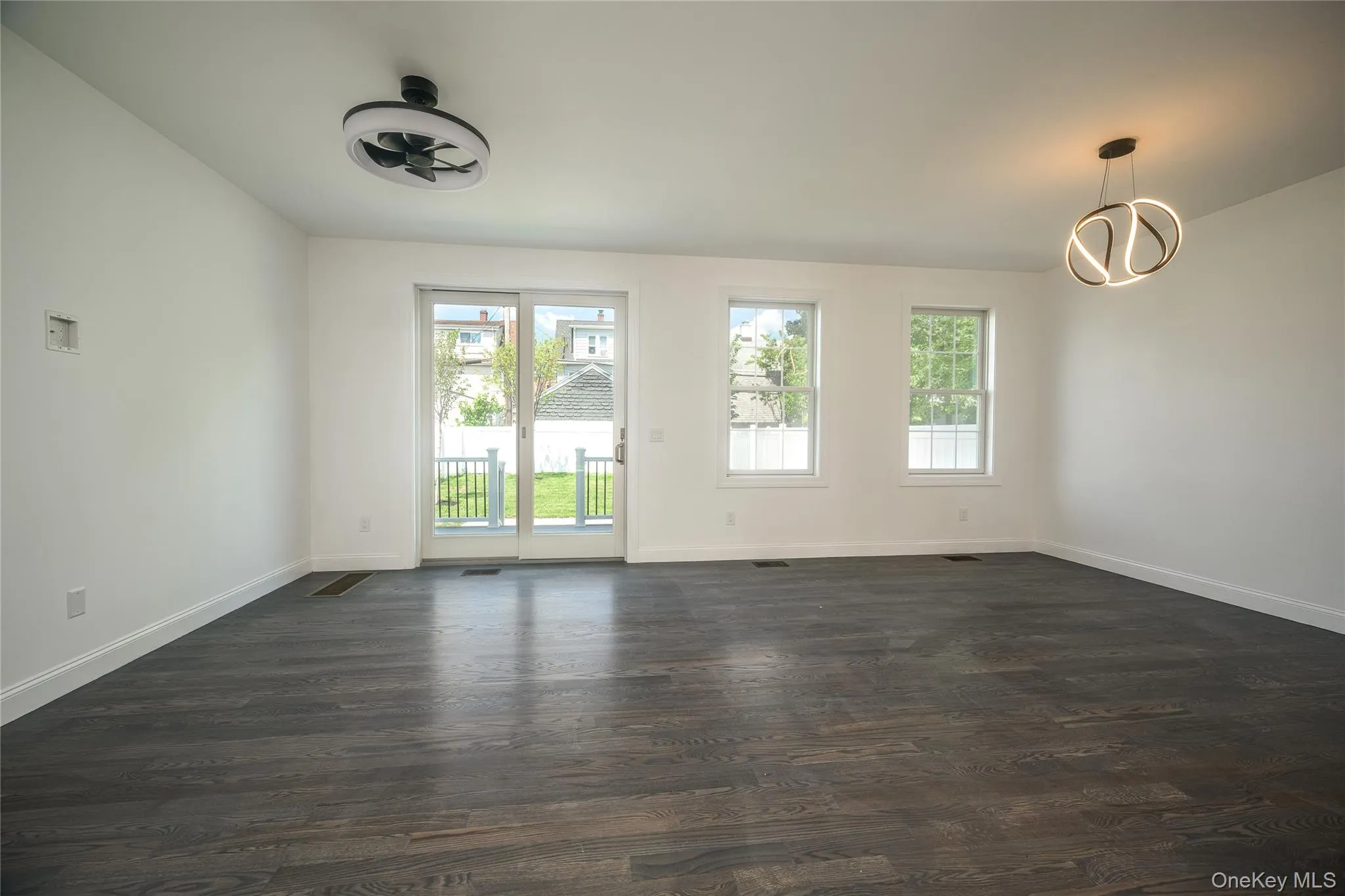 Open floor plan to sliders to deck and fenced in backyard Open floor plan to sliders to deck and fenced in backyard