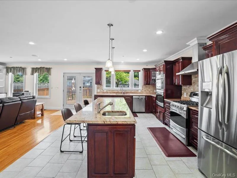 Kitchen featuring stainless steel appliances, open floor plan. Kitchen featuring stainless steel appliances, open floor plan.