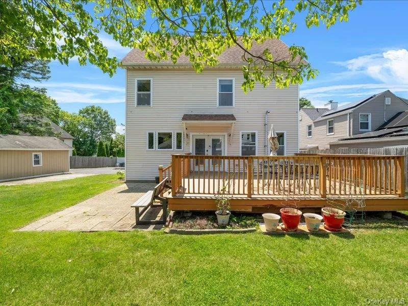 Back of house featuring french doors, a patio, and a deck Back of house featuring french doors, a patio, and a deck