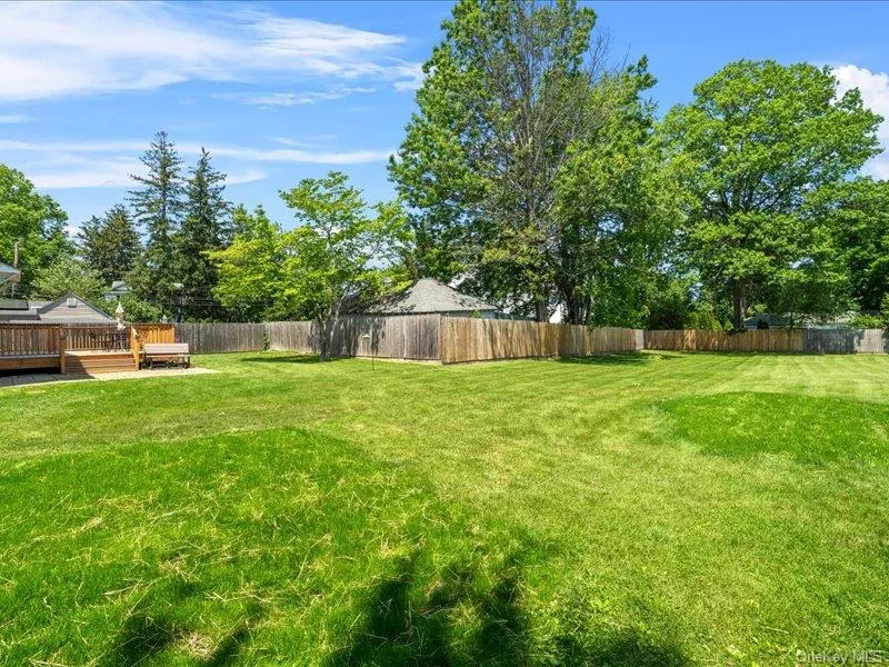 View of yard featuring a deck View of yard featuring a deck