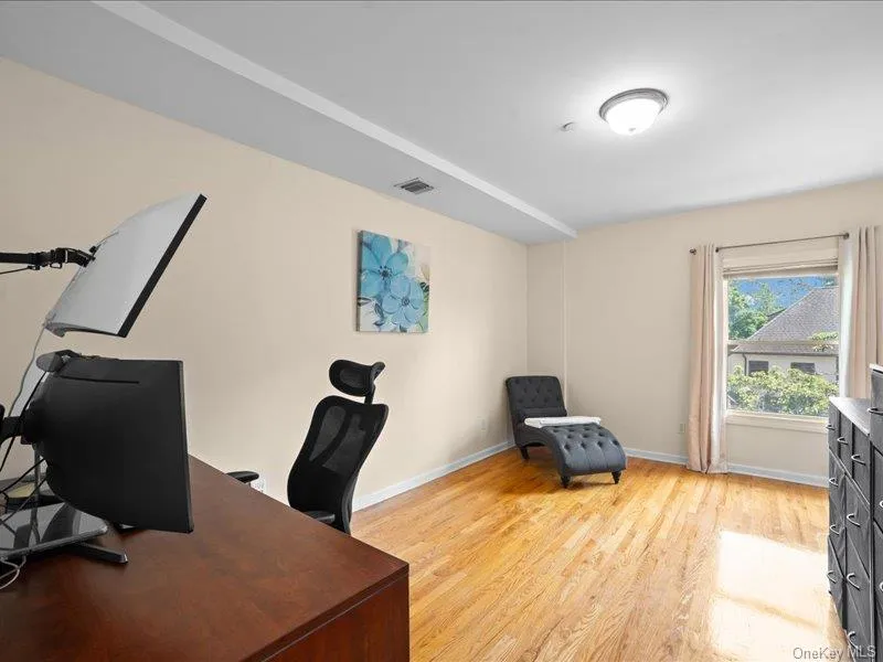 Office with light wood finished floors and baseboards Office with light wood finished floors and baseboards