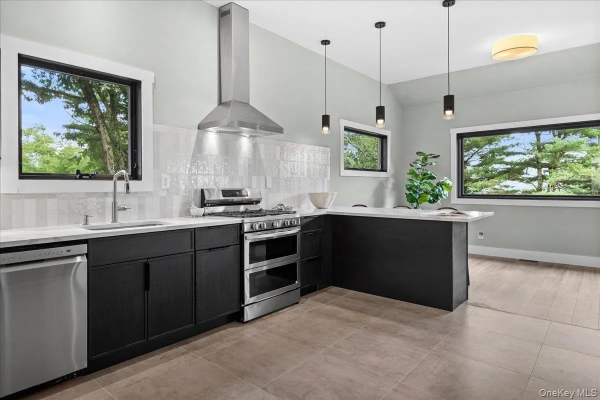 Brand-new stainless steel appliances, quartz countertops, and pendant lighting Brand-new stainless steel appliances, quartz countertops, and pendant lighting