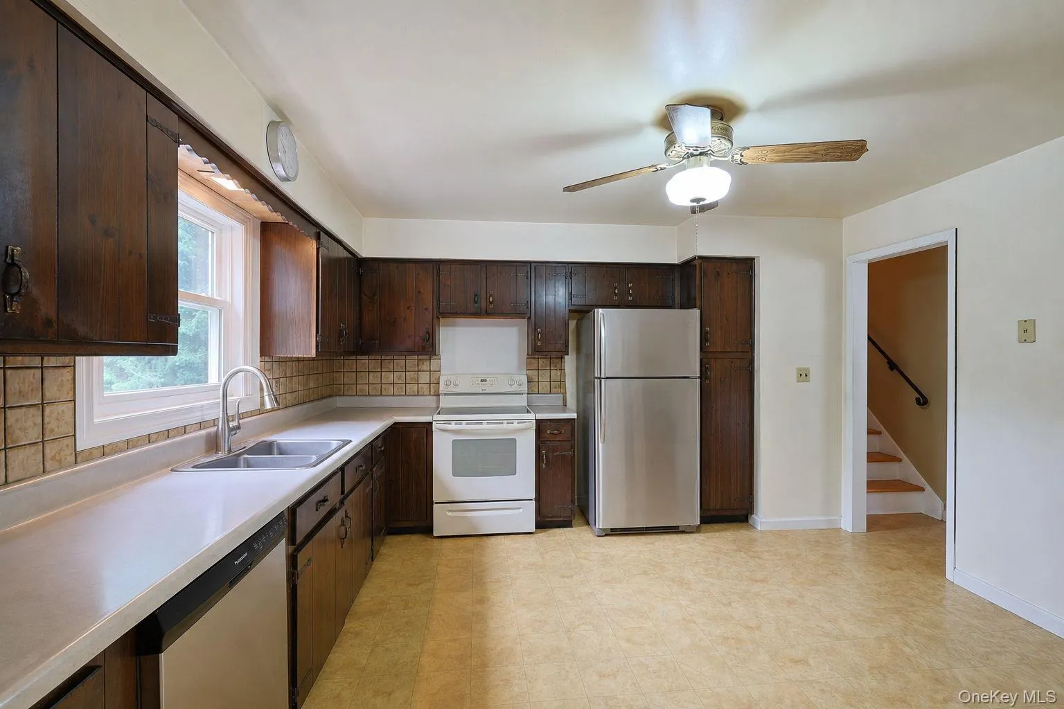Virtually staged kitchen with table removed. Virtually staged kitchen with table removed.