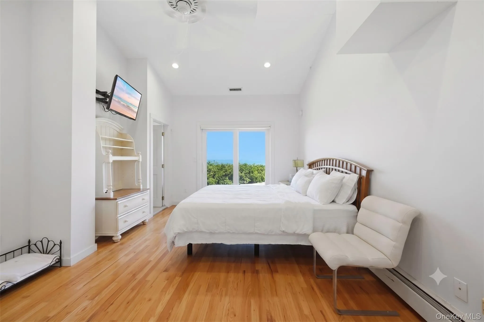 1st floor primary with solarium, walk in closet, ensuite, and endless views 1st floor primary with solarium, walk in closet, ensuite, and endless views