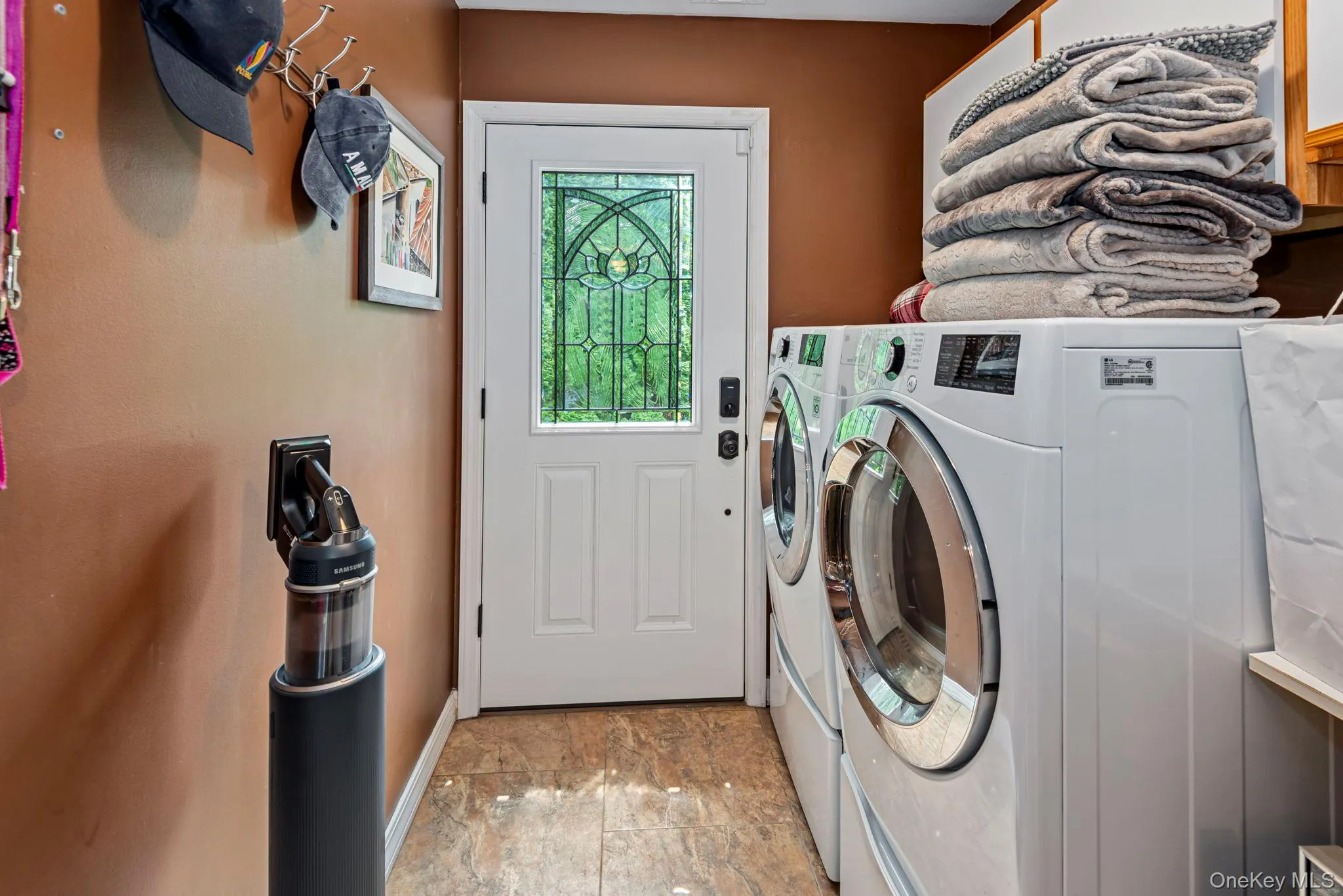 First Floor Laundry Room has LG Washer & Dryer & access to Courtyard First Floor Laundry Room has LG Washer & Dryer & access to Courtyard