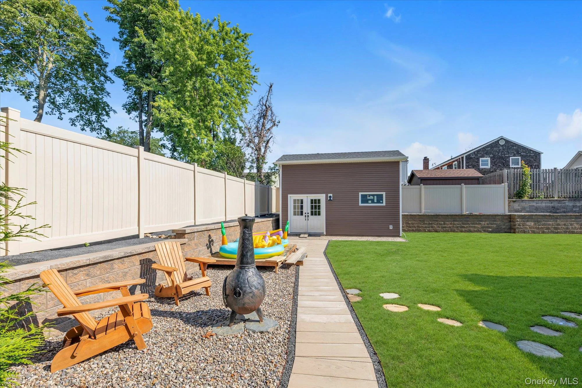 Yard with large second shed and additional sitting area. Yard with large second shed and additional sitting area.