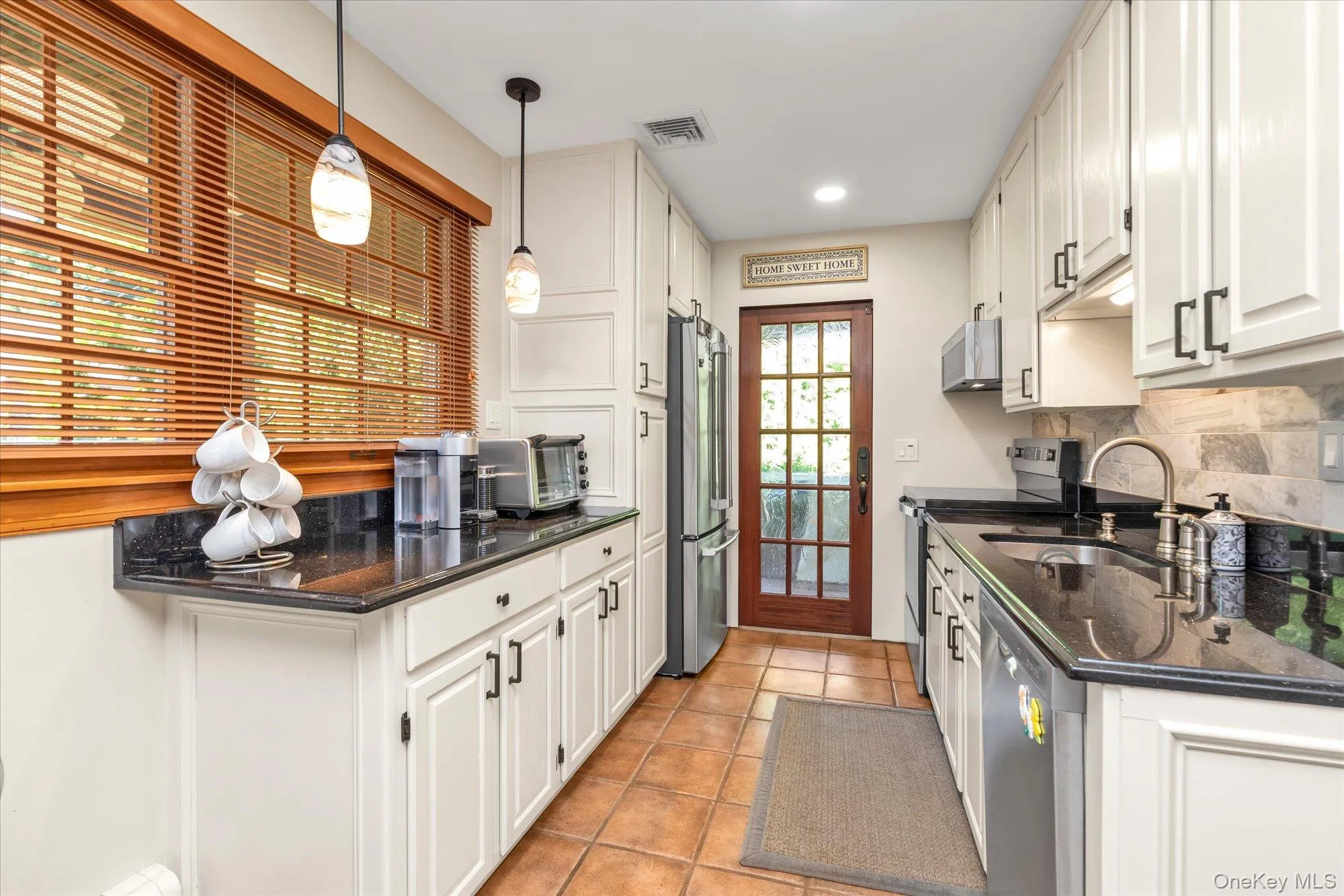 Eat-in-kitchen with granite countertops, new backsplash, stainless steel refrigerator, dishwasher and stove. Eat-in-kitchen with granite countertops, new backsplash, stainless steel refrigerator, dishwasher and stove.