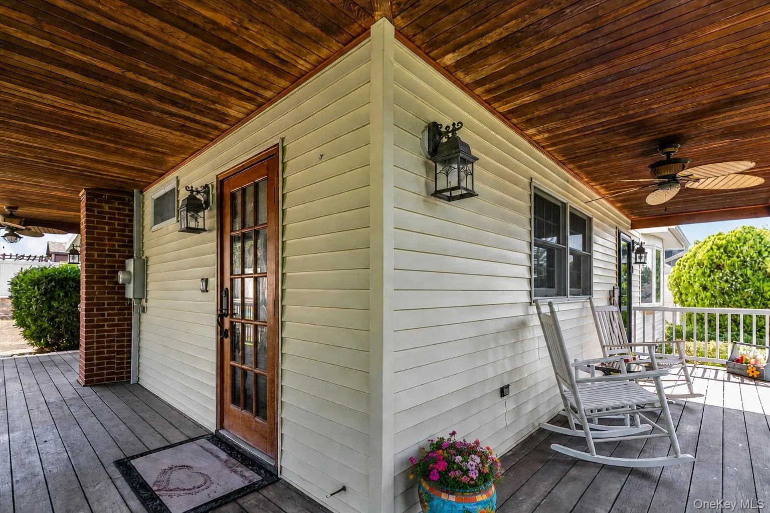 Large redwood wrap-around-porch with ceiling fan. Large redwood wrap-around-porch with ceiling fan.