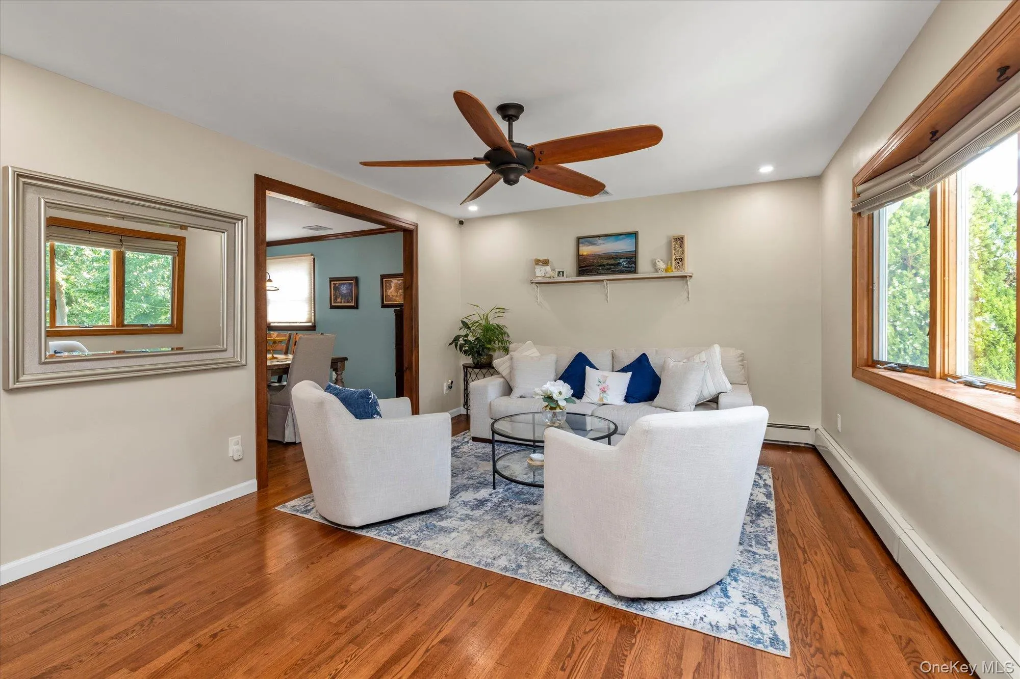 Formal living room with hardwood floors and recessed lighting. Formal living room with hardwood floors and recessed lighting.