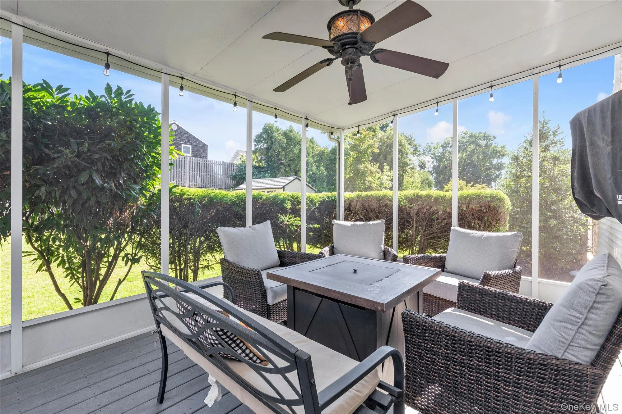 Back screened-in-patio with low maintenance decking and television connectivity. Back screened-in-patio with low maintenance decking and television connectivity.