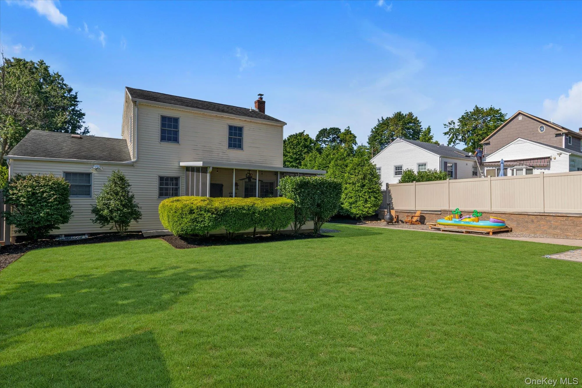 Large completely fenced backyard with two sheds, new masonry work, new vinyl fence and mature landscaping. Large completely fenced backyard with two sheds, new masonry work, new vinyl fence and mature landscaping.