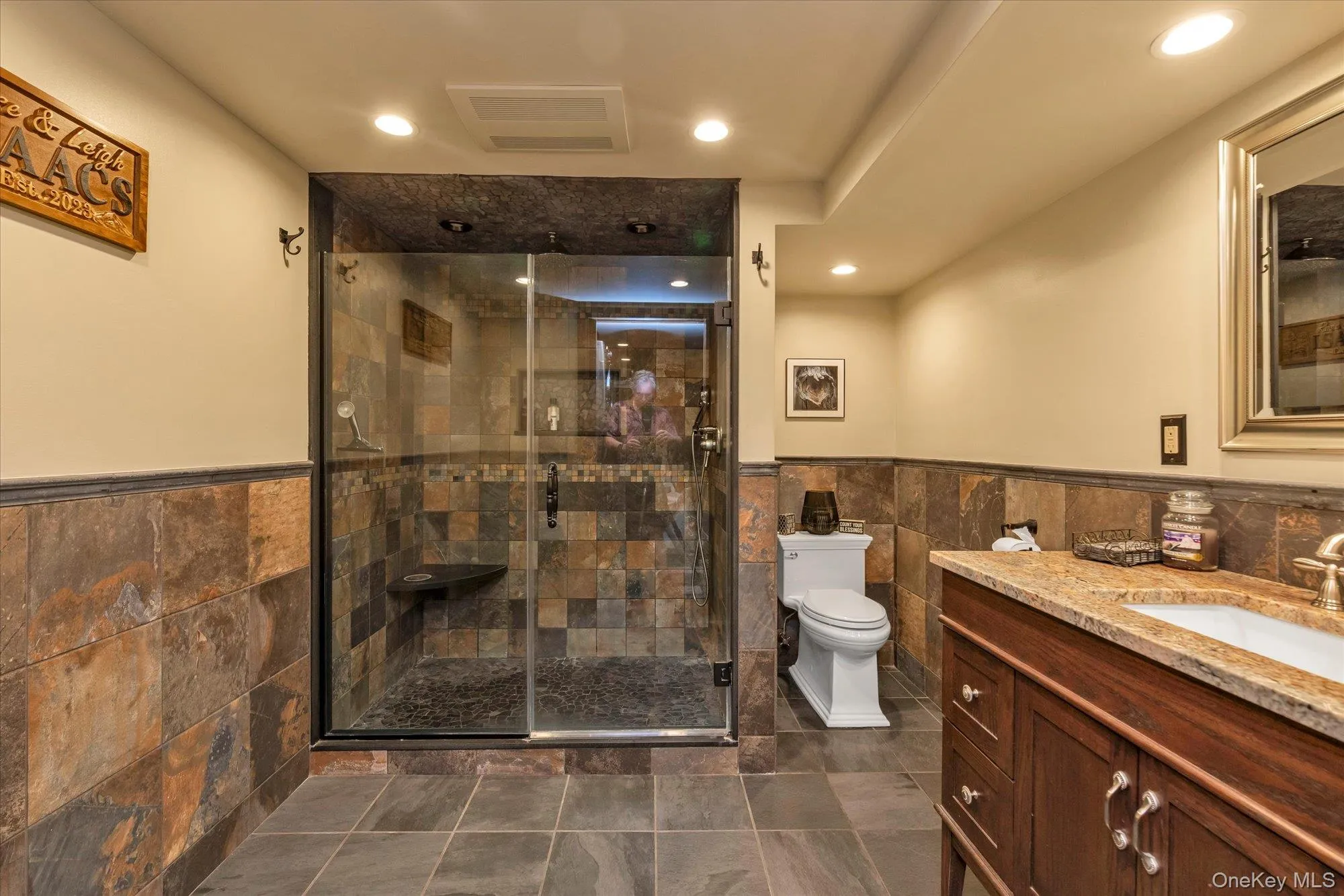 Full bathroom, off of recreational room, on lower level with granite counter tops Full bathroom, off of recreational room, on lower level with granite counter tops