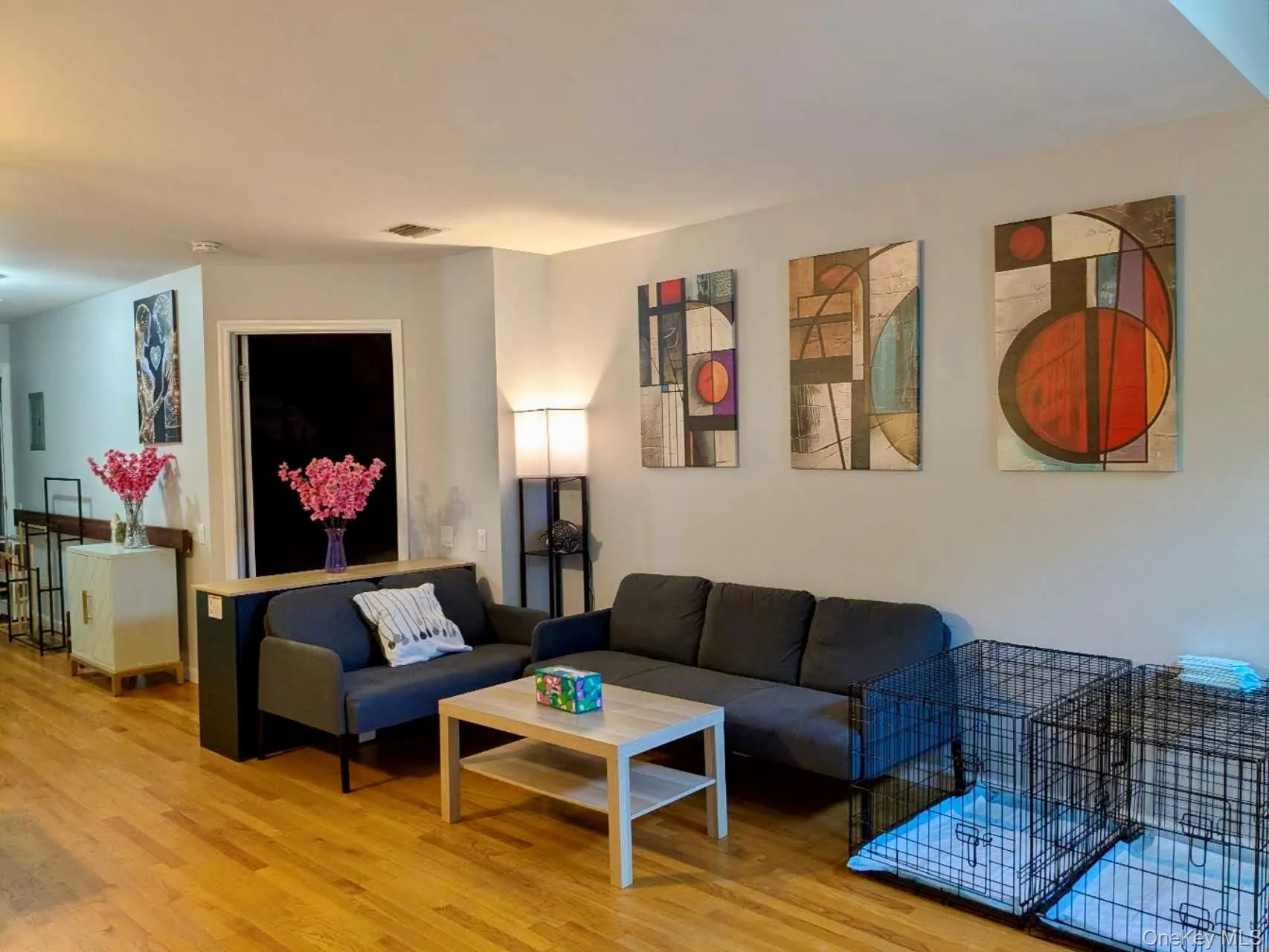 Hardwood flooring extends throughout this open living area Hardwood flooring extends throughout this open living area