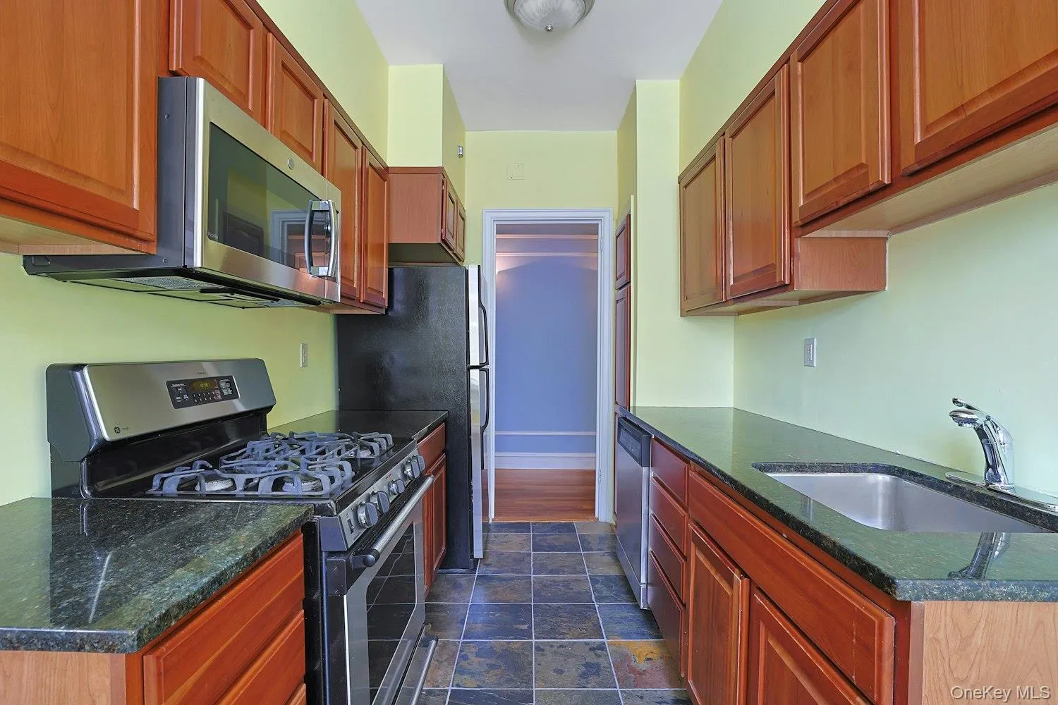 Efficient Galley-Style Kitchen with Abundant Storage and Workspace Efficient Galley-Style Kitchen with Abundant Storage and Workspace