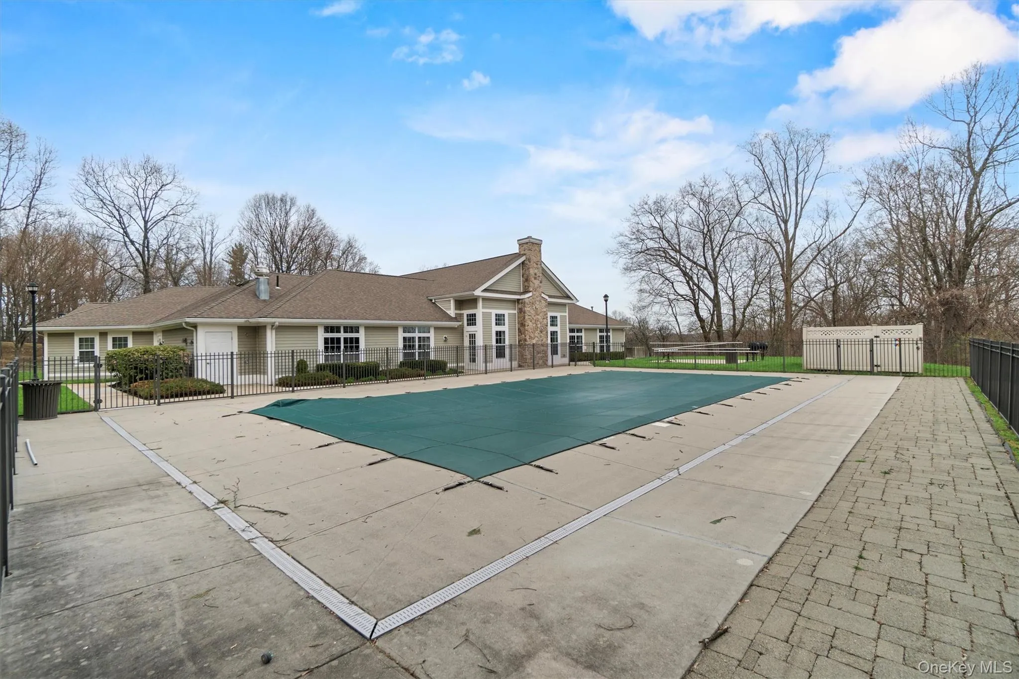Pool featuring a patio and fence Pool featuring a patio and fence