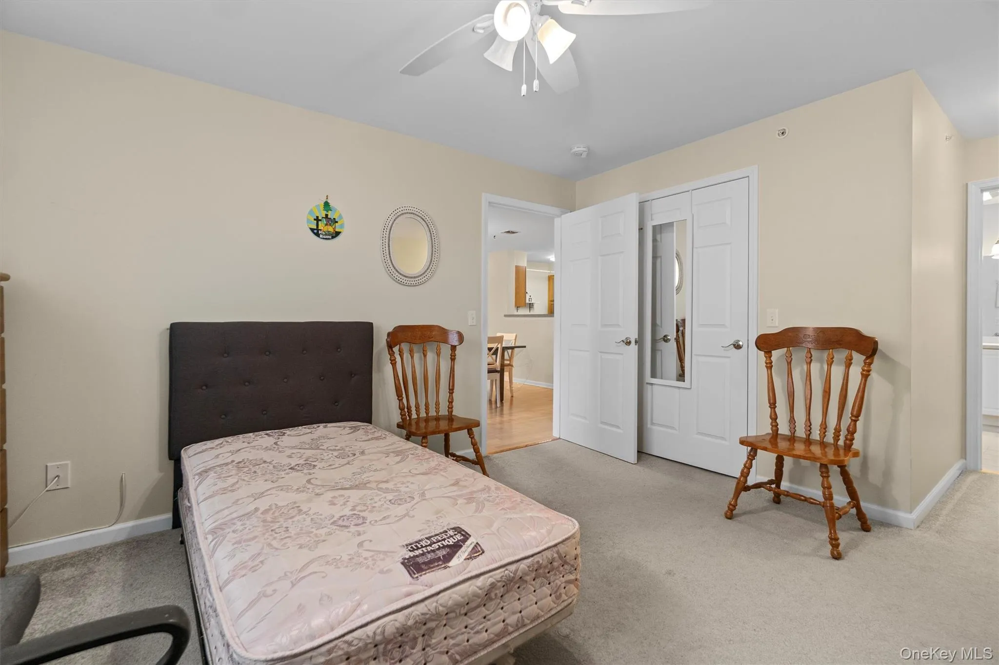 Carpeted bedroom with ceiling fan Carpeted bedroom with ceiling fan